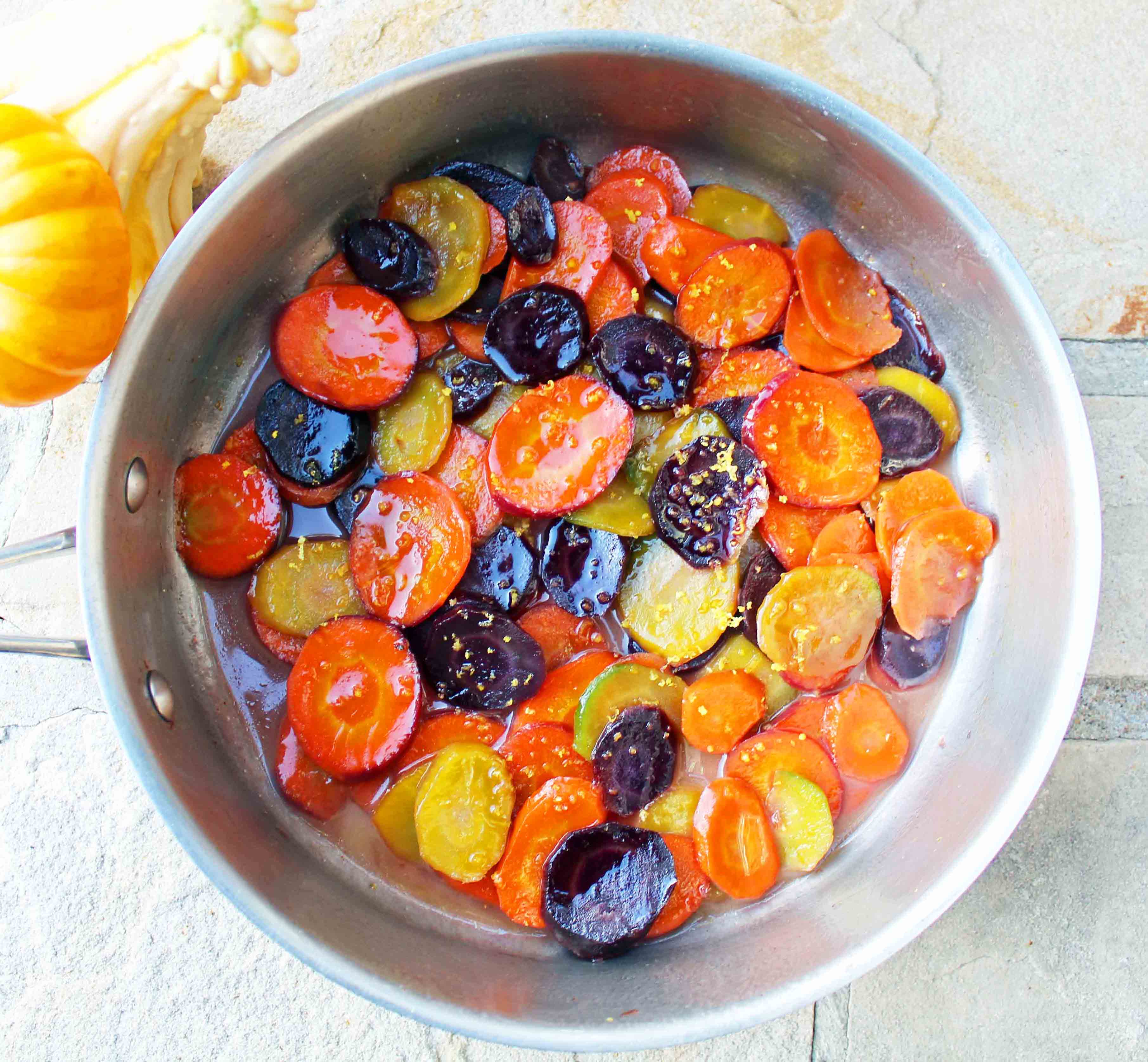 Honey Butter Glazed Carrots by Modern Honey. Heirloom Carrots, Sweet Cream Butter, Creamy Honey, and Lemon Zest make these carrots a real crowd pleaser. A simple but flavorful side dish.