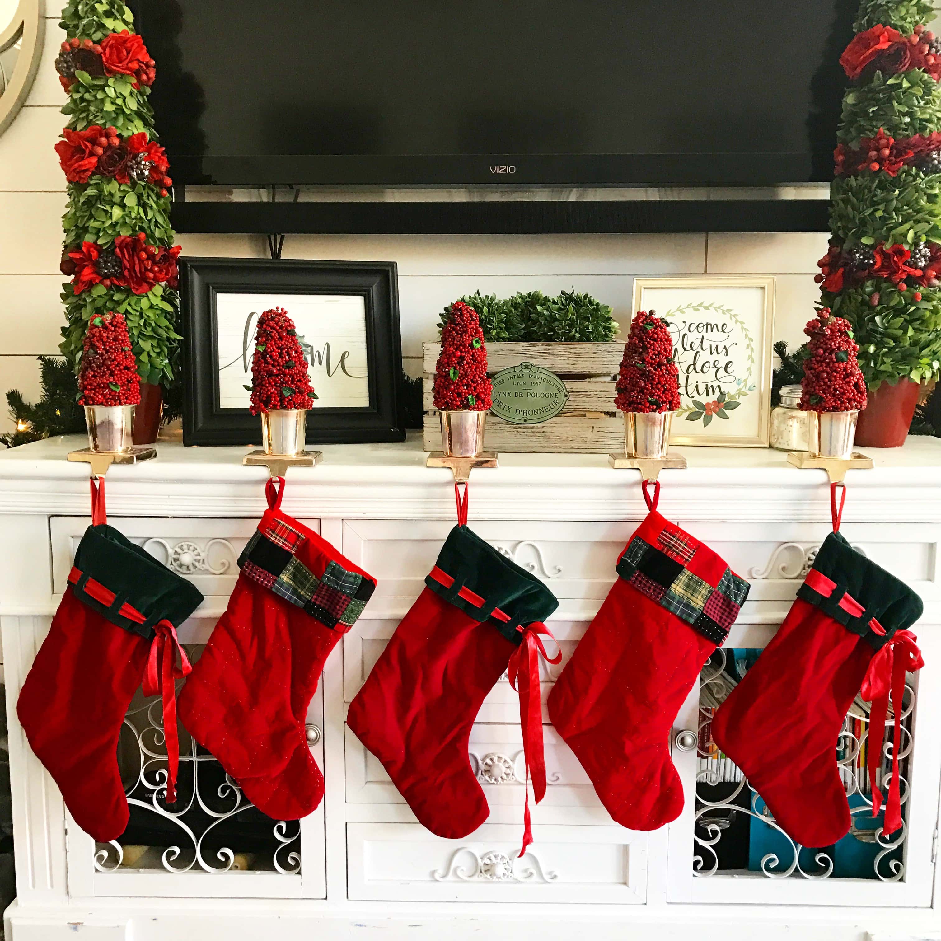 Christmas Decor Ideas by Modern Honey. Stockings display in family room.