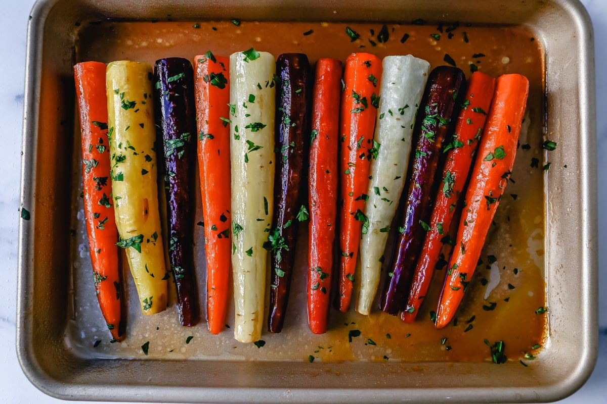 These roasted carrots are  made with butter, honey, salt, and a touch of fresh lemon zest. These are the best honey glazed carrots and a perfect classic side dish.