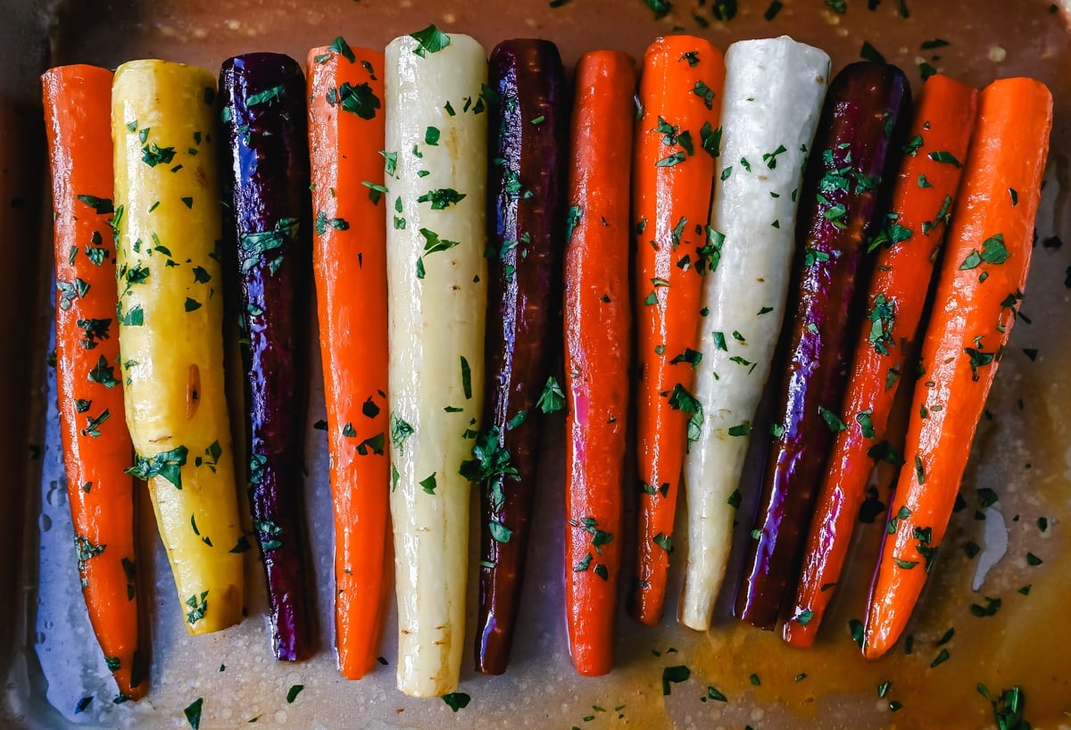 These roasted carrots are  made with butter, honey, salt, and a touch of fresh lemon zest. These are the best honey glazed carrots and a perfect classic side dish.