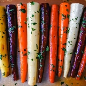 These roasted carrots are made with butter, honey, salt, and a touch of fresh lemon zest. These are the best honey glazed carrots and a perfect classic side dish.