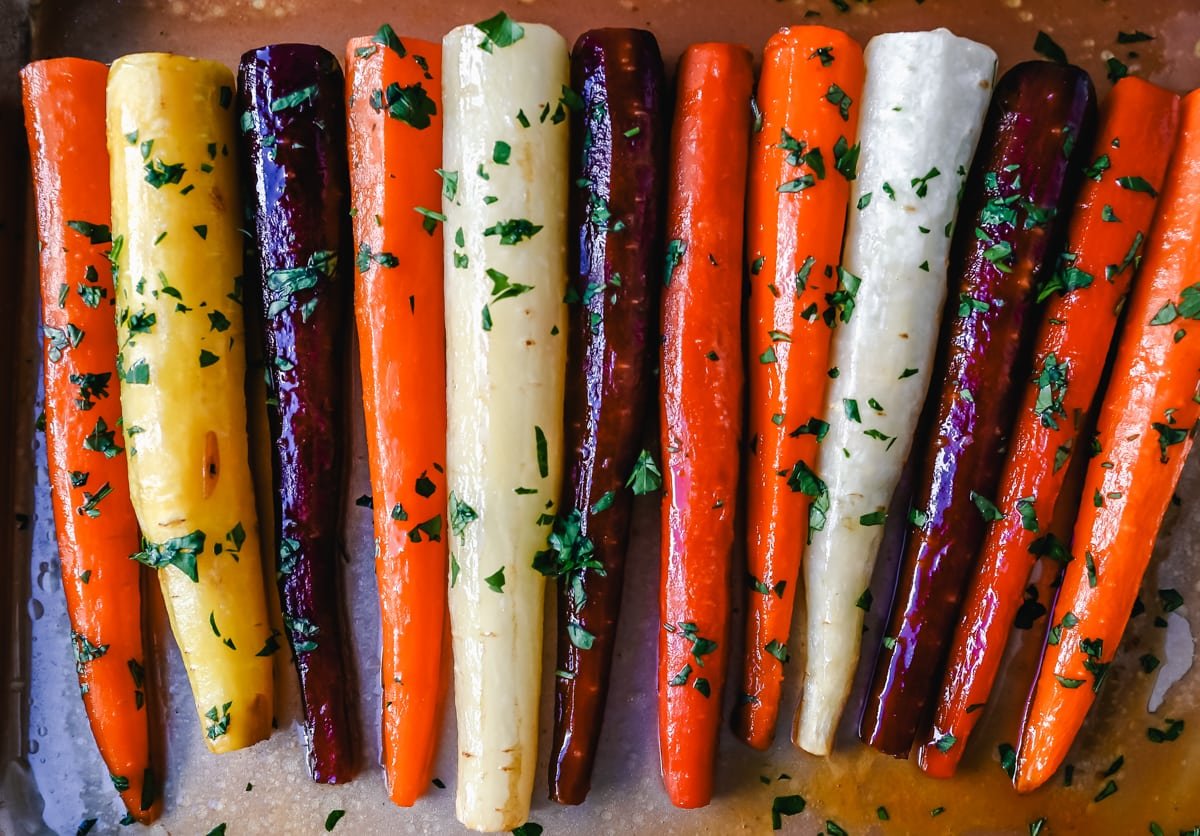 These roasted carrots are  made with butter, honey, salt, and a touch of fresh lemon zest. These are the best honey glazed carrots and a perfect classic side dish.