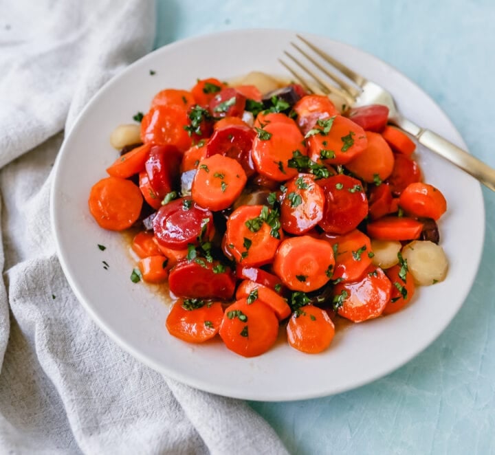 These roasted carrots are  made with butter, honey, salt, and a touch of fresh lemon zest. These are the best honey glazed carrots and a perfect classic side dish.