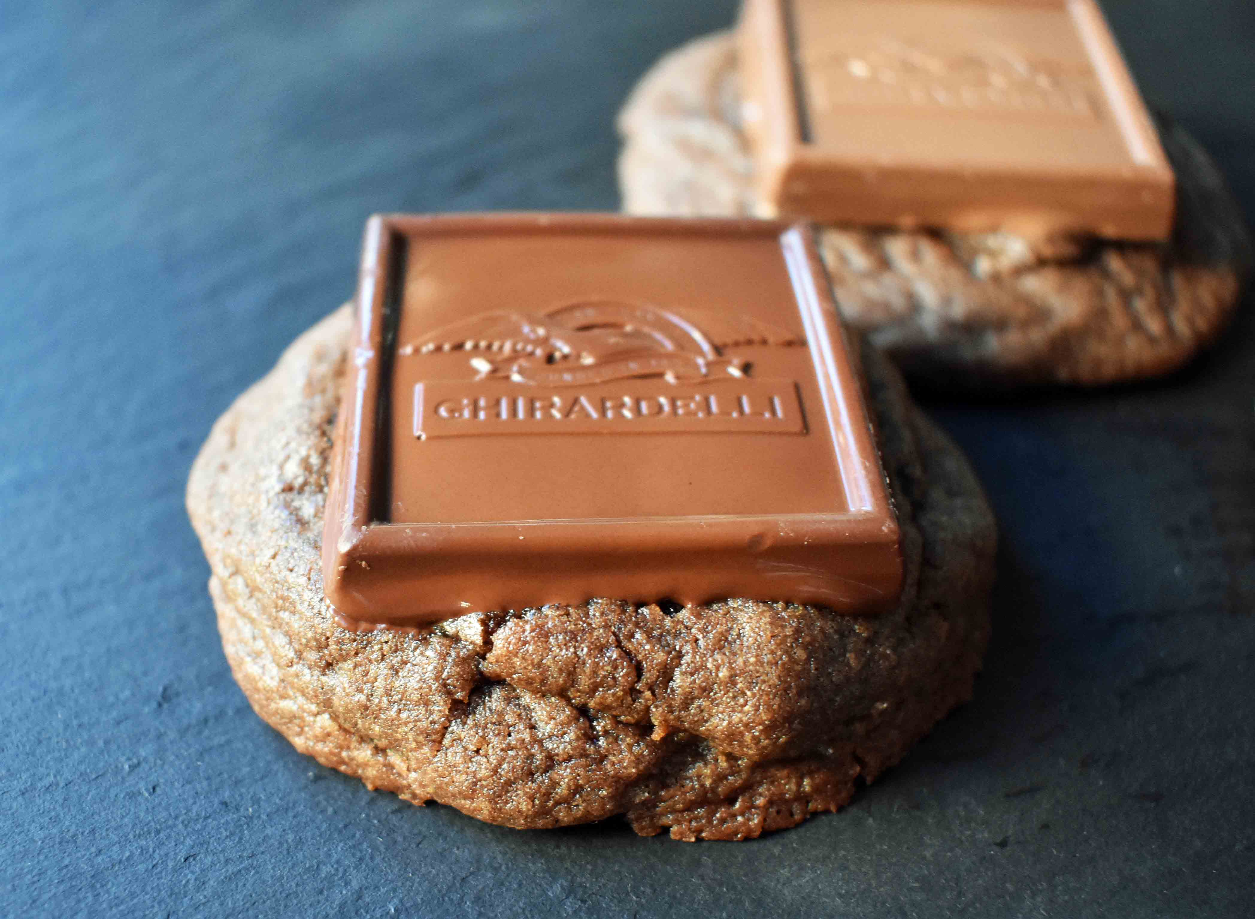 Ghirardelli Squares Chocolate Cookies. Double Chocolate Cookies topped with a creamy Ghirardelli square chocolate. Milk Chocolate Caramel, Dark Chocolate Mint,or Peppermint Bark Ghirardelli Squares are placed on top of this decadent cookie. A crowd favorite!