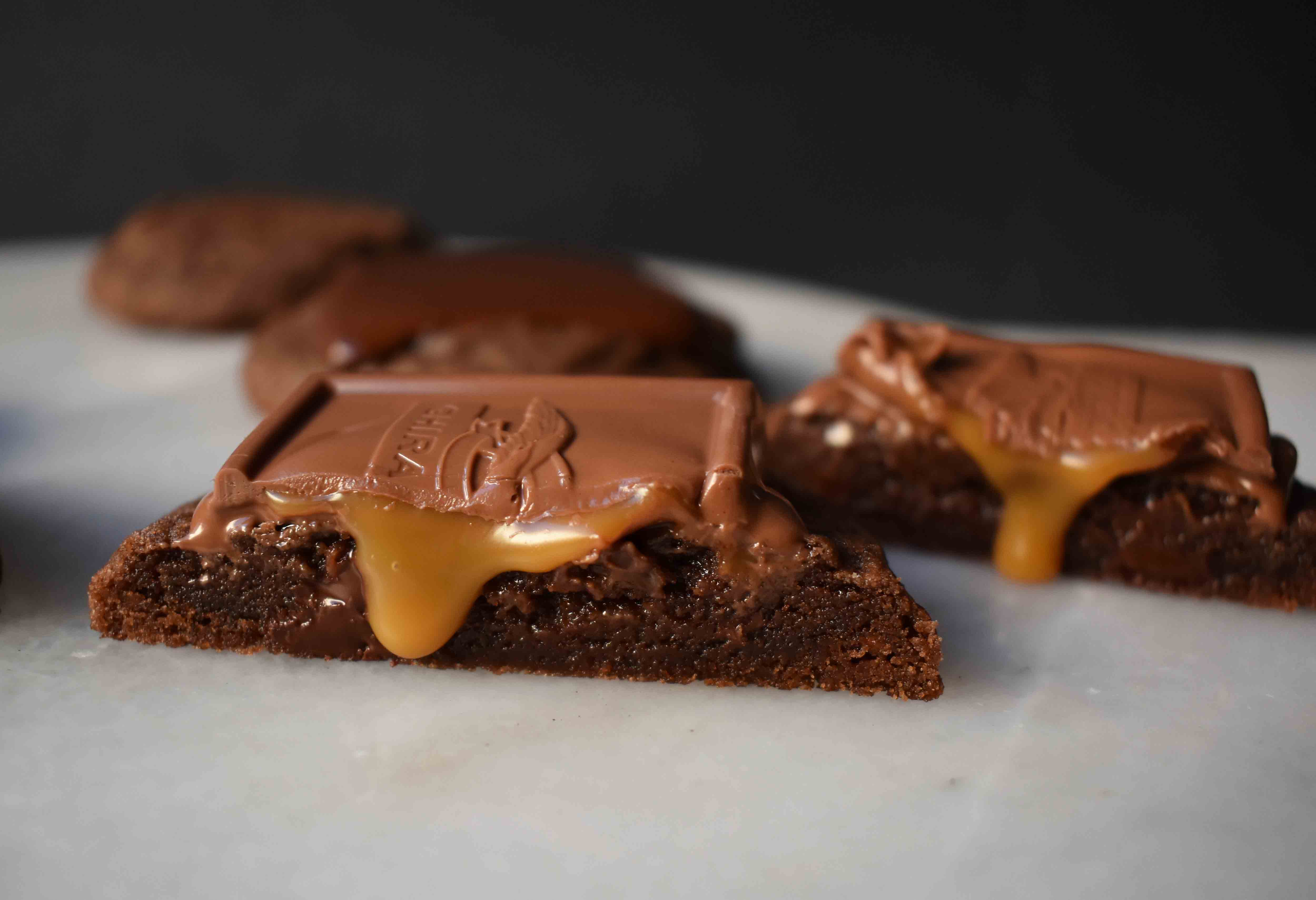 Ghirardelli Squares Chocolate Cookies. Double Chocolate Cookies topped with a creamy Ghirardelli square chocolate. Milk Chocolate Caramel, Dark Chocolate Mint,or Peppermint Bark Ghirardelli Squares are placed on top of this decadent cookie. A crowd favorite!