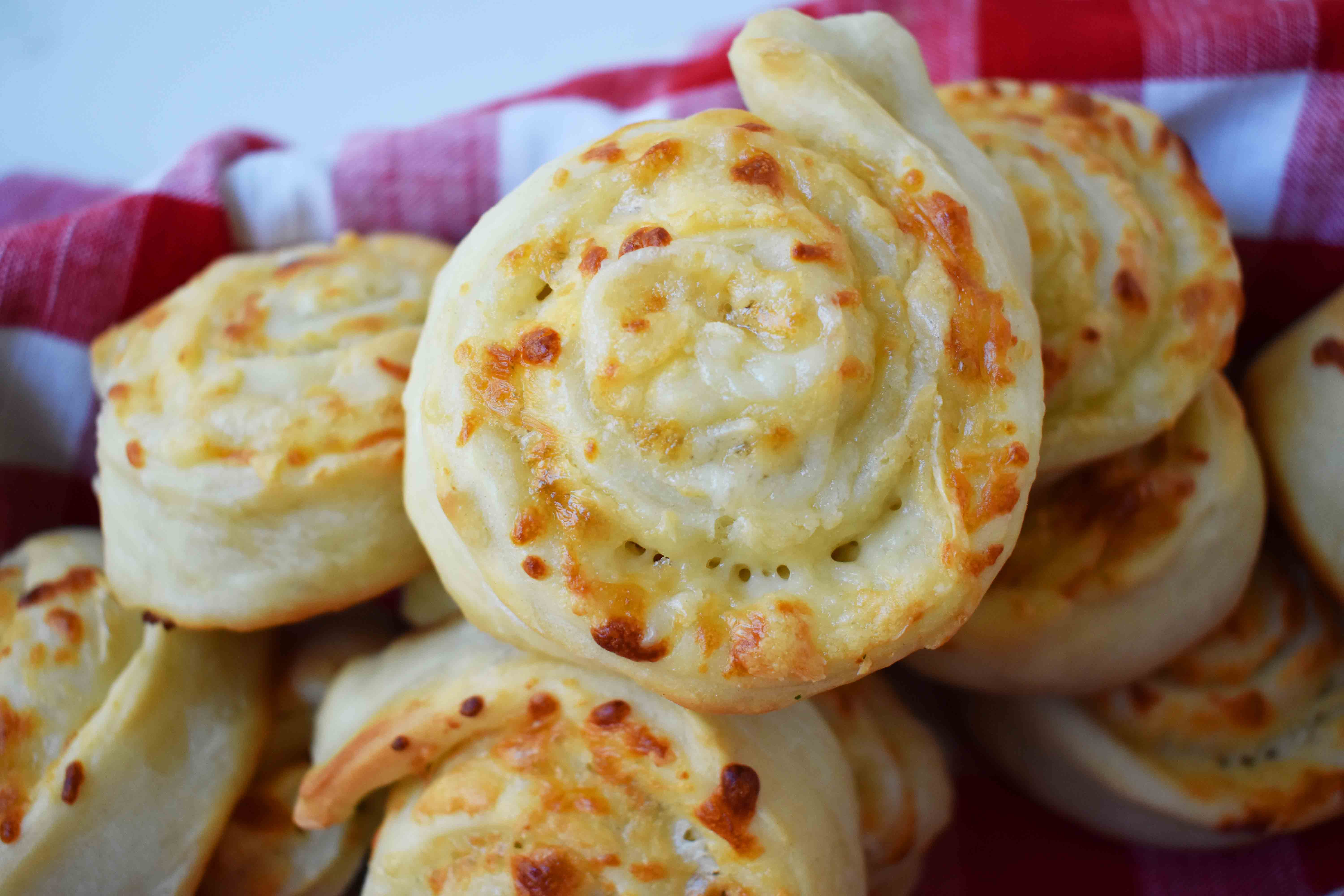 Golden's Garlic Parmesan Cheese Rolls by Modern Honey. Made with 5 simple ingredients -- pizza dough, butter, garlic powder, parmesan and mozzarella cheese. 