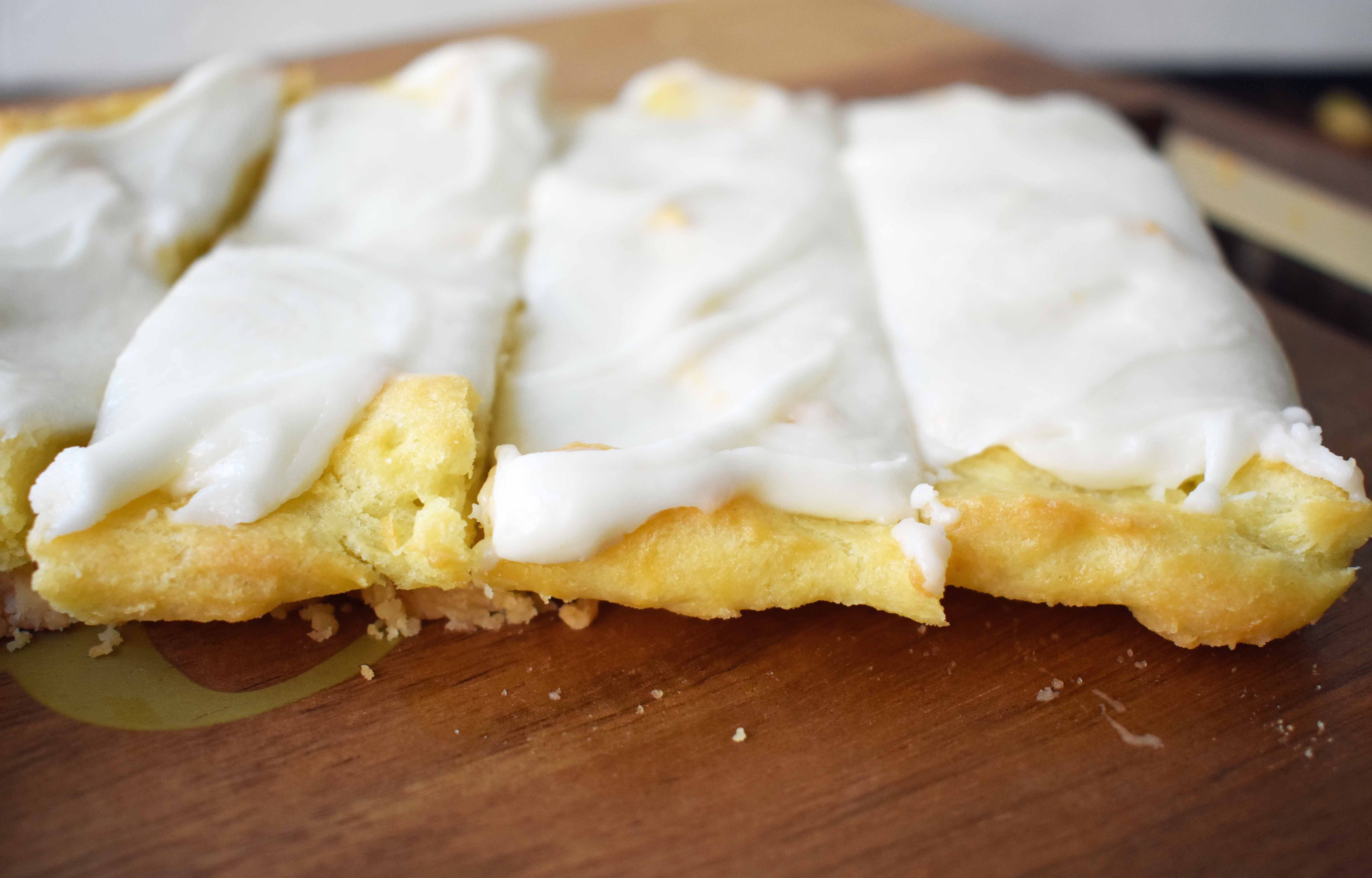 Swedish Pastry by Modern Honey. Buttery flaky layers with almond filling and topped with sweet cream frosting. A popular homemade European pastry. 