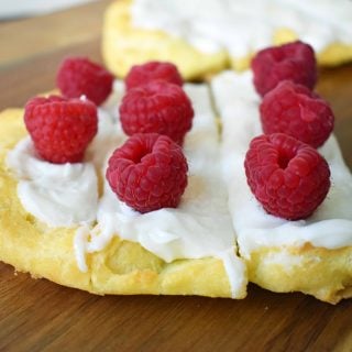Swedish Pastry by Modern Honey. Buttery flaky layers with almond filling and topped with sweet cream frosting. A popular homemade European pastry.