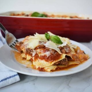 Italian Bolognese Lasagna. Authentic Italian recipe made with a traditional meat sauce, a creamy bechamel sauce, parmesan and mozzarella cheeses.