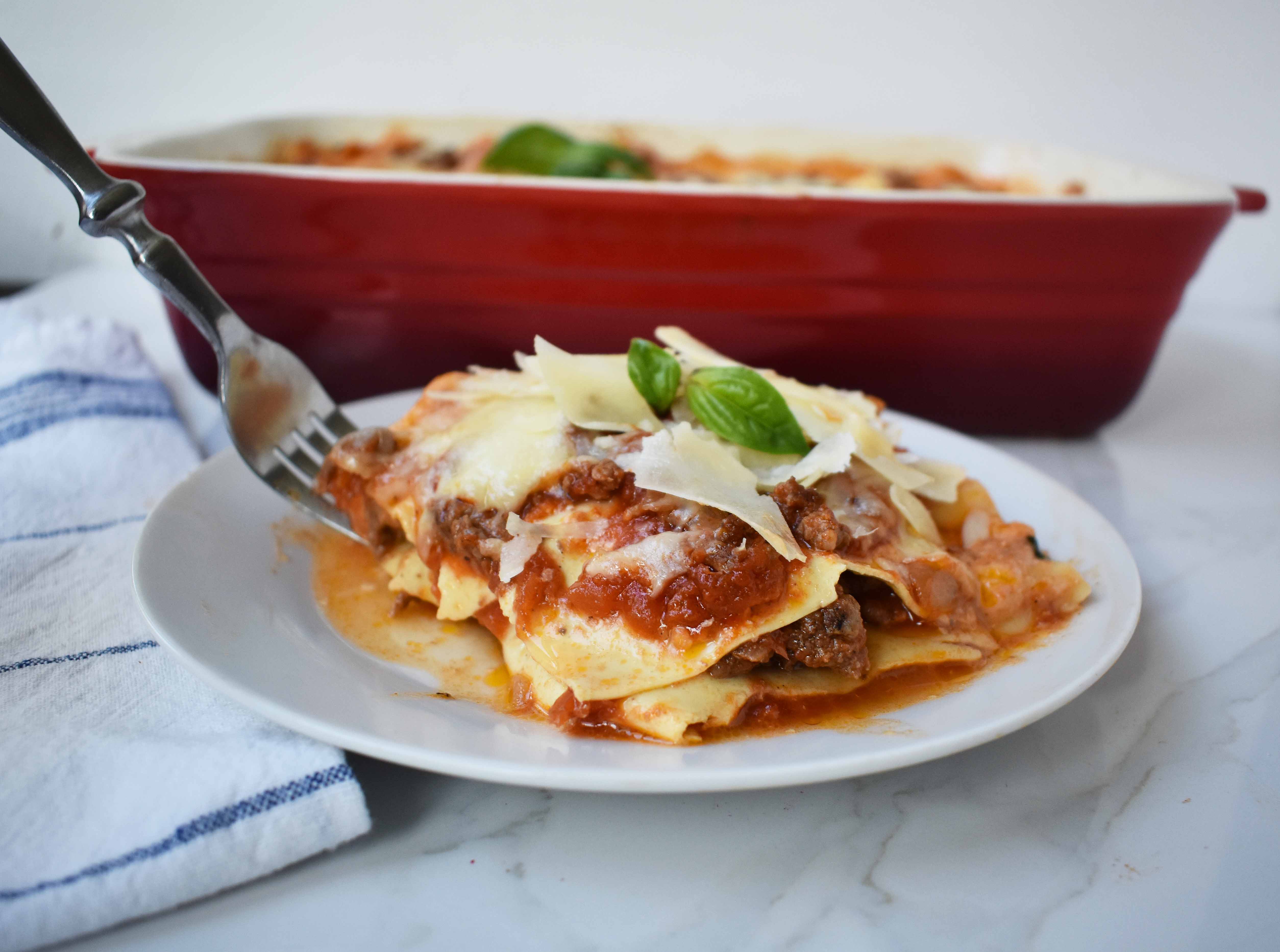 Italian Bolognese Lasagna. Authentic Italian recipe made with a traditional meat sauce, a creamy bechamel sauce, parmesan and mozzarella cheeses. 
