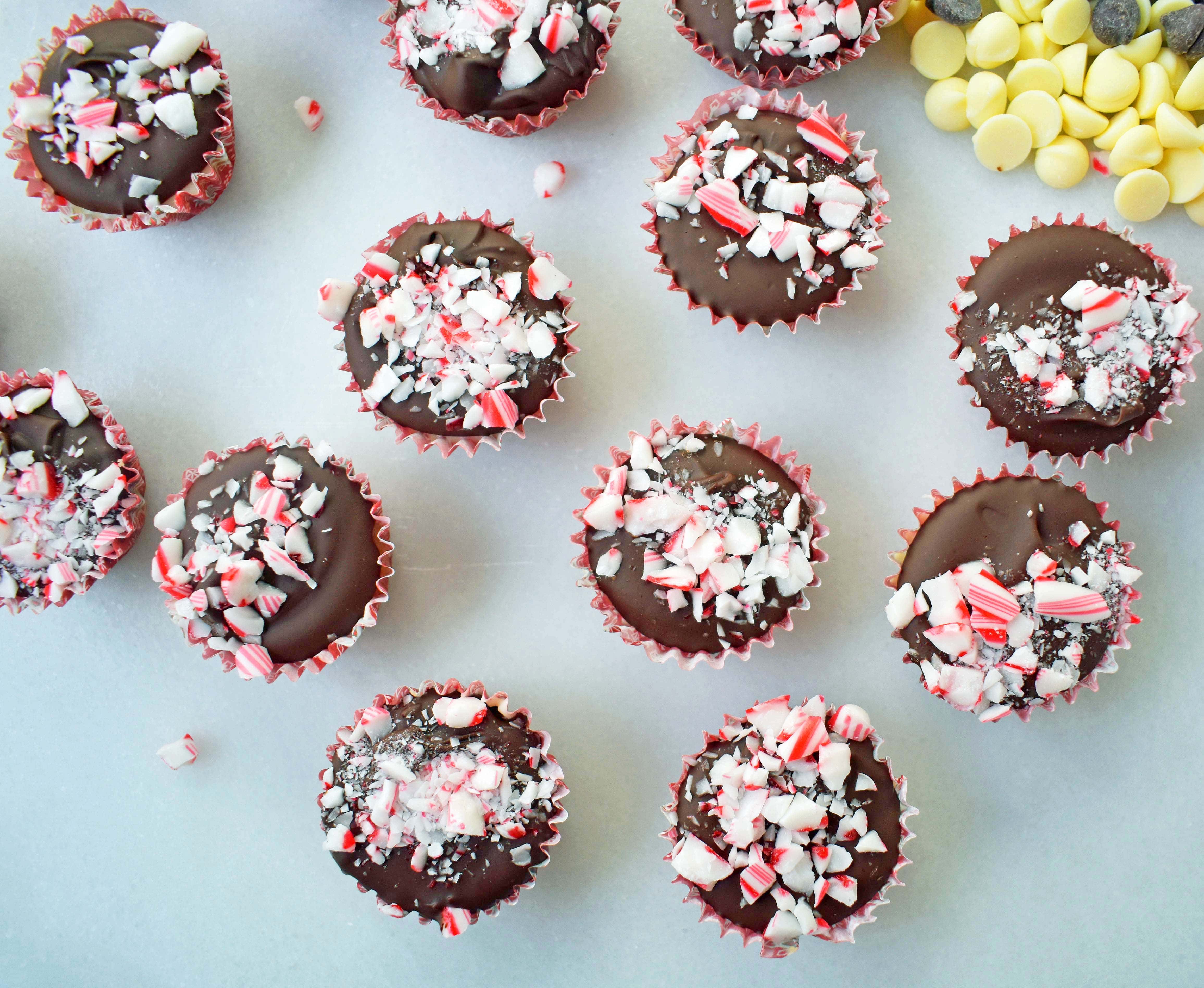 Peppermint Bark Cookie Dough Cups by Modern Honey. Egg Free Chocolate Chip Cookie Dough layered with white chocolate and semisweet chocolate and topped with crushed candy canes. 