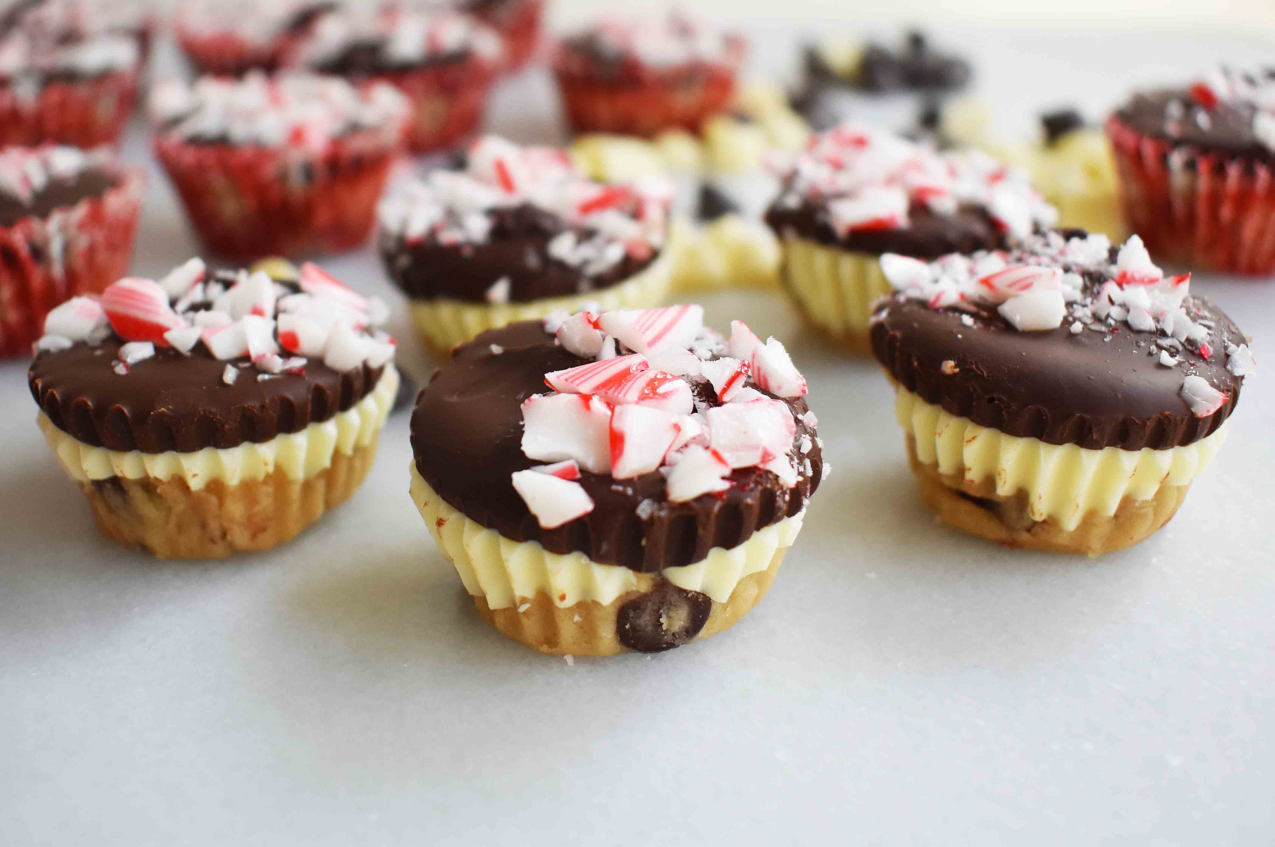 Peppermint Bark Cookie Dough Cups by Modern Honey. Egg Free Chocolate Chip Cookie Dough layered with white chocolate and semisweet chocolate and topped with crushed candy canes. 