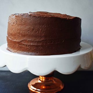 Yellow Birthday Cake with Milk Chocolate Frosting by Modern Honey. Homemade Yellow Cake with Vanilla Pudding Mix to make it extra moist and flavorful. Rich chocolate buttercream is the perfect addition to this birthday cake.