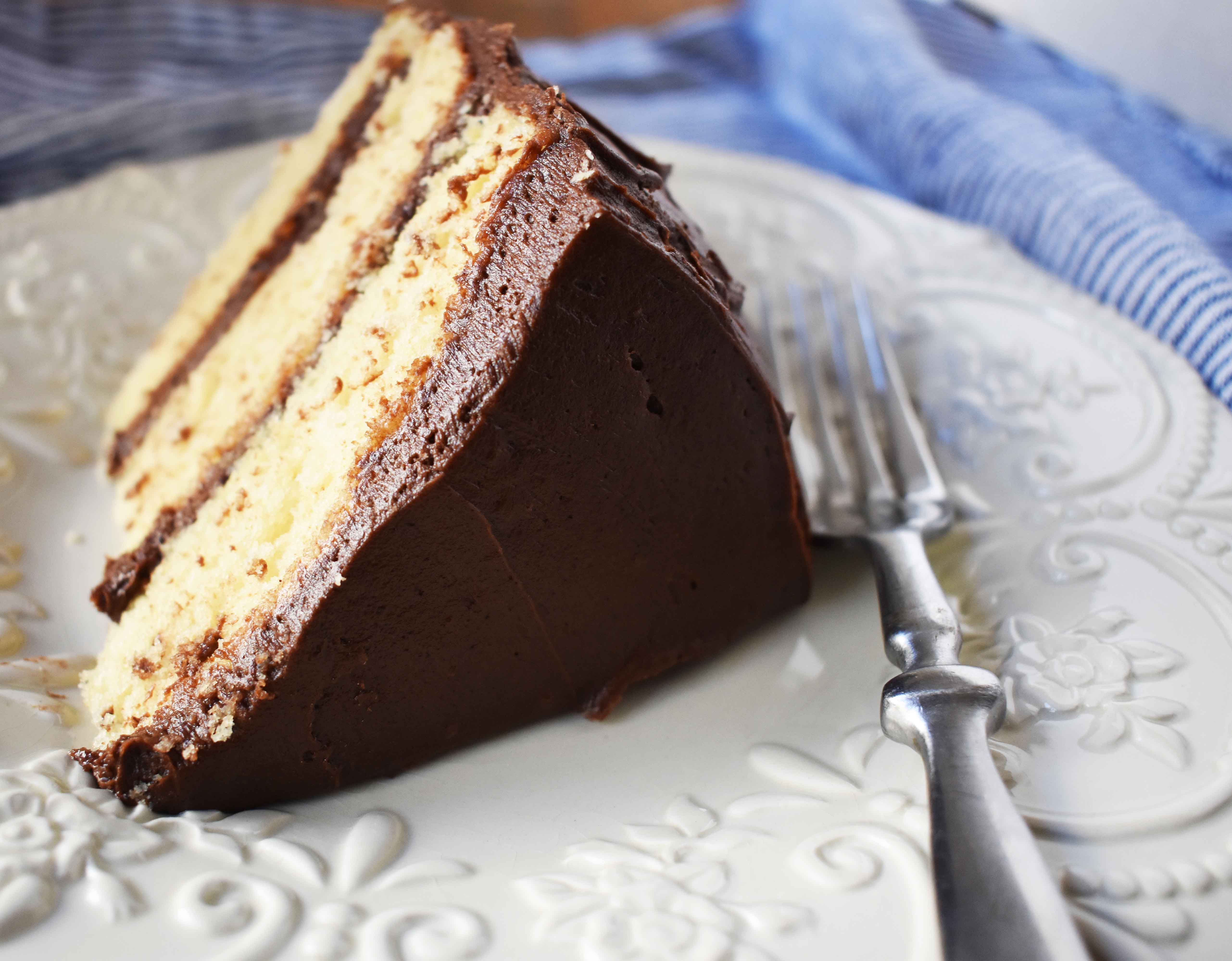 Yellow Birthday Cake with Milk Chocolate Frosting by Modern Honey. Homemade Yellow Cake with Vanilla Pudding Mix to make it extra moist and flavorful. Rich chocolate buttercream is the perfect addition to this birthday cake.