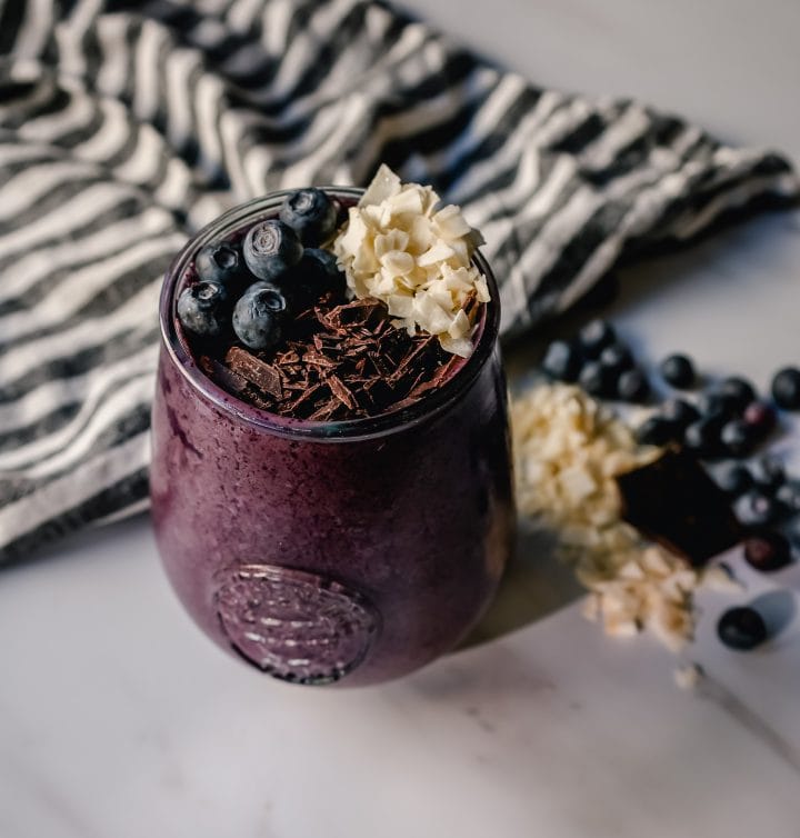 This Berry Chocolate Smoothie is full of blueberries, chocolate protein powder, almond or coconut milk, and almond butter. You can even add in a little banana for extra sweetness. This healthy chocolate blueberry smoothie is full of antioxidants and protein and is the perfect start for your day!