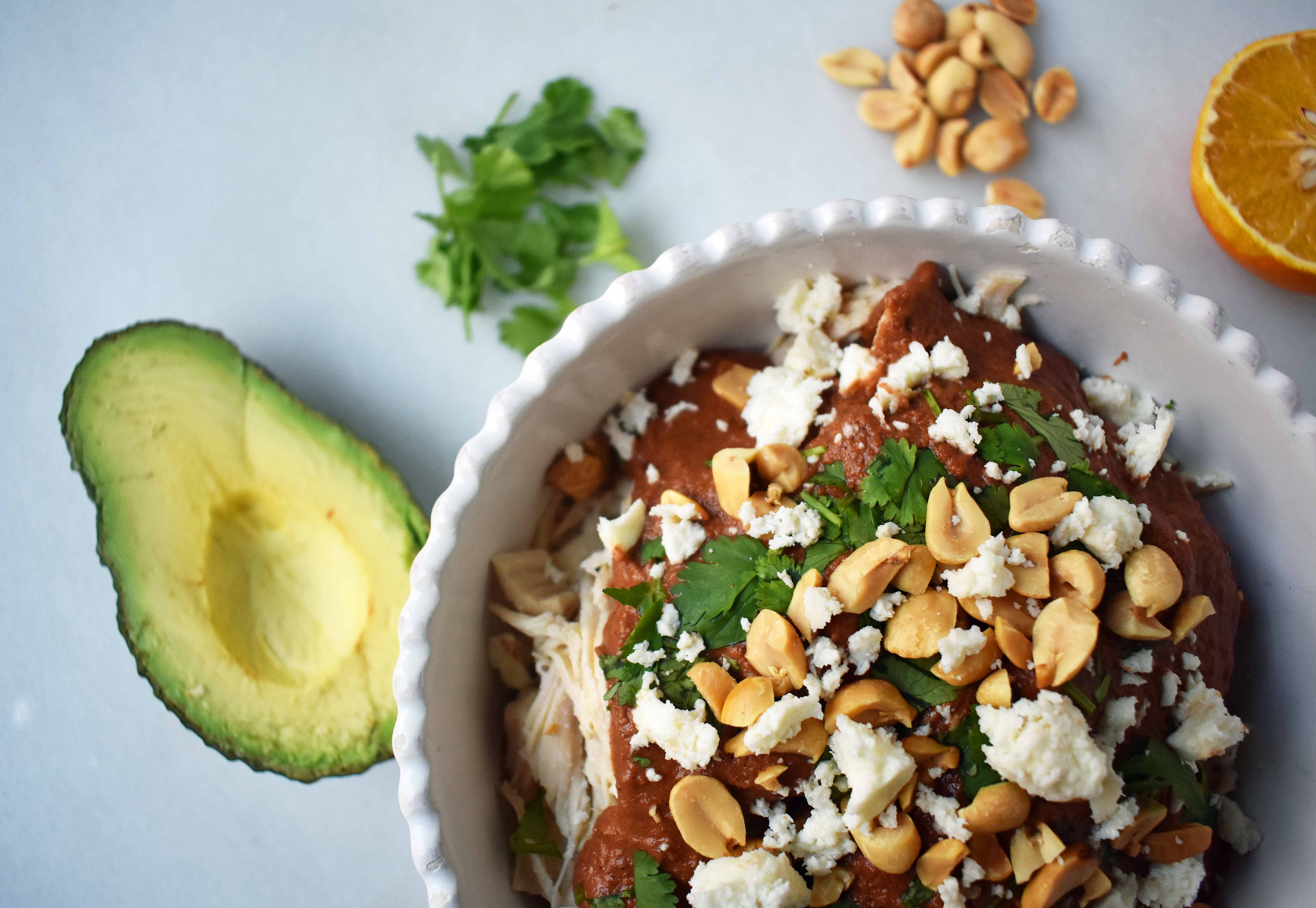 Crockpot Mexican Chicken Mole. Rich mole made easy in a slow cooker. Tender chicken covered in a rich, spiced, flavorful mole sauce. Can be made into chicken mole tacos by placing inside corn tortillas and topping with queso fresco, cilantro, white onion, and avocado. An easy crockpot dinner!