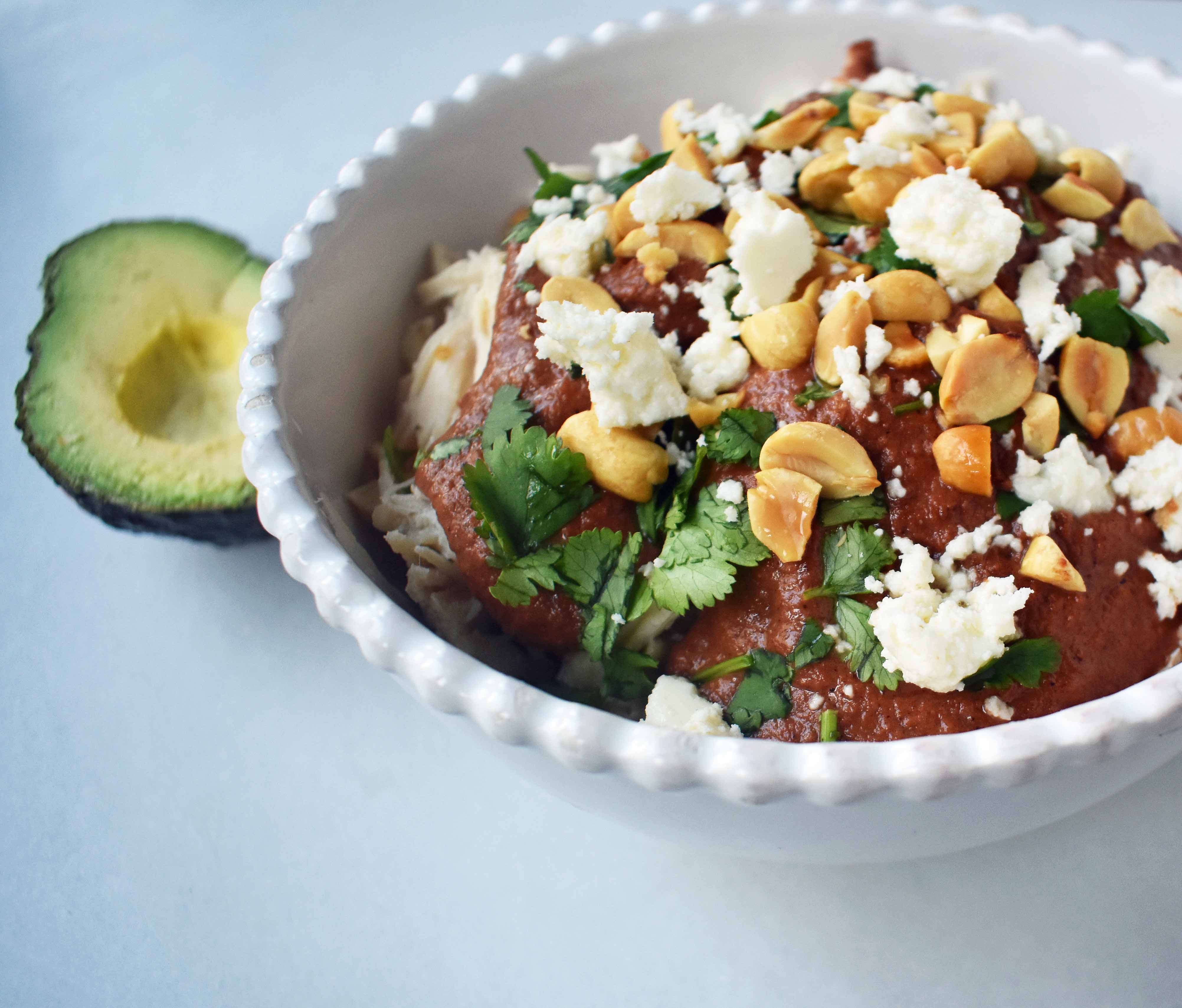 Crockpot Mexican Chicken Mole. Rich mole made easy in a slow cooker. Tender chicken covered in a rich, spiced, flavorful mole sauce. Can be made into chicken mole tacos by placing inside corn tortillas and topping with queso fresco, cilantro, white onion, and avocado. An easy crockpot dinner!