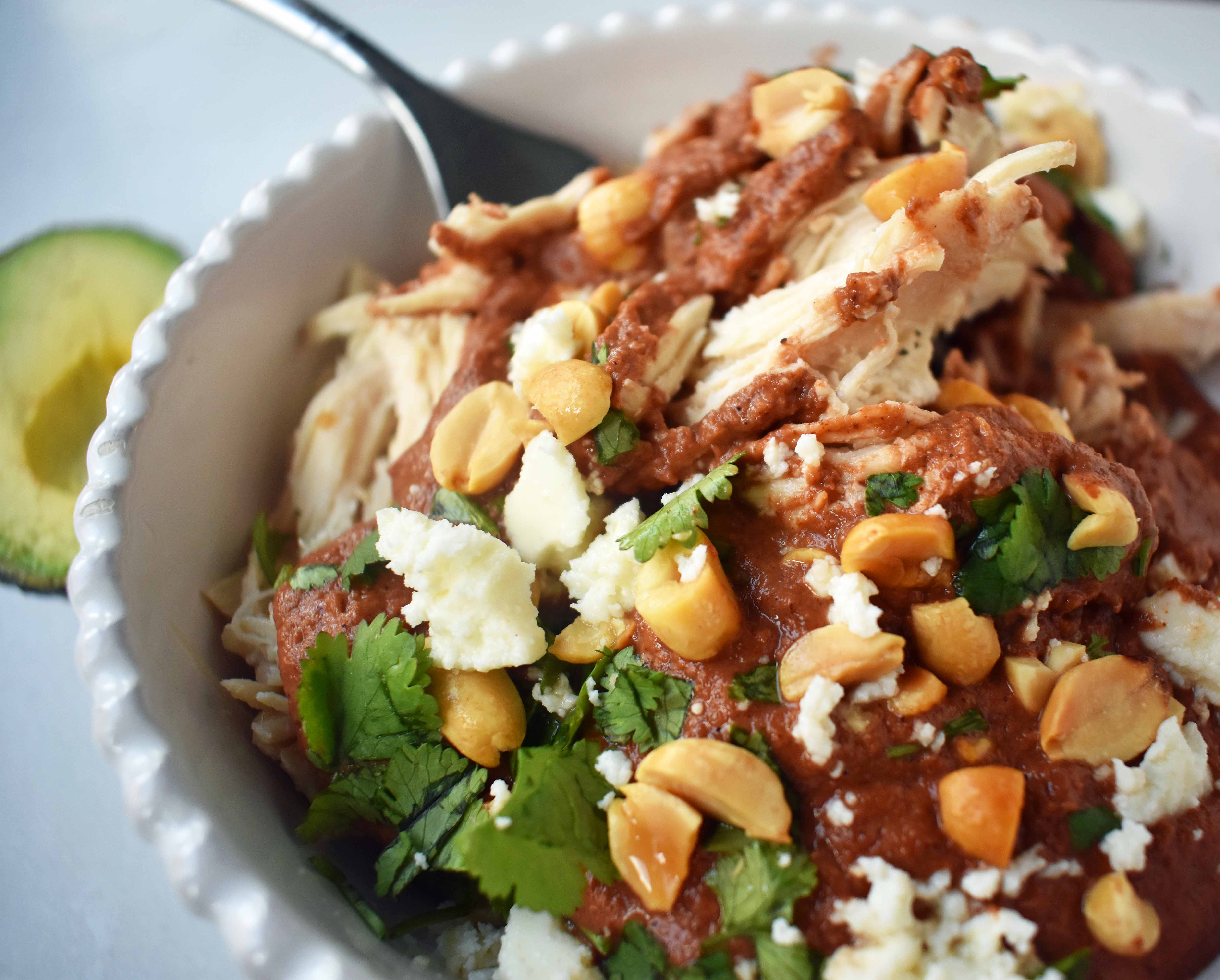 Crockpot Mexican Chicken Mole. Rich mole made easy in a slow cooker. Tender chicken covered in a rich, spiced, flavorful mole sauce. Can be made into chicken mole tacos by placing inside corn tortillas and topping with queso fresco, cilantro, white onion, and avocado. An easy crockpot dinner!