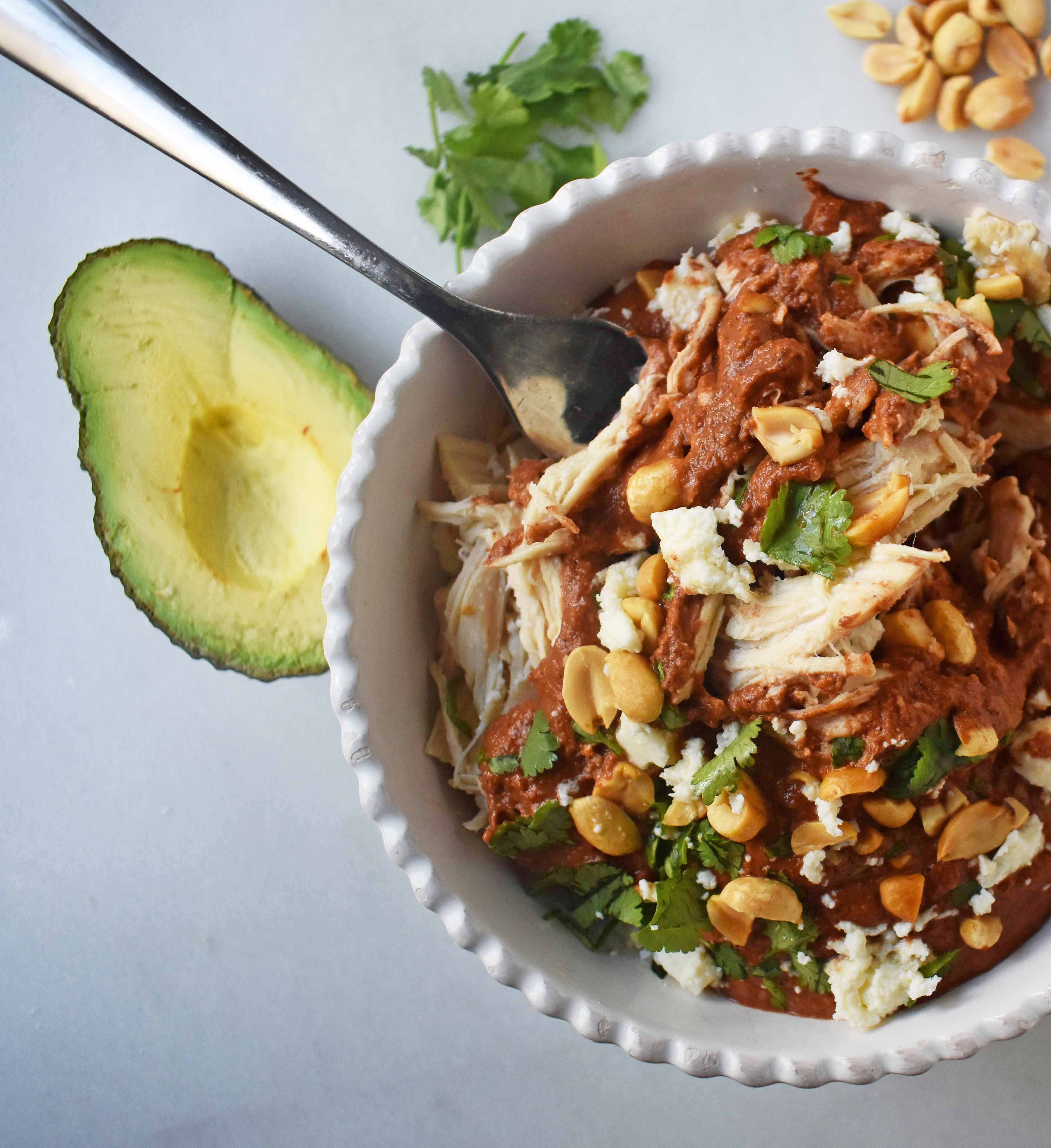 Crockpot Mexican Chicken Mole. Rich mole made easy in a slow cooker. Tender chicken covered in a rich, spiced, flavorful mole sauce. Can be made into chicken mole tacos by placing inside corn tortillas and topping with queso fresco, cilantro, white onion, and avocado. An easy crockpot dinner!