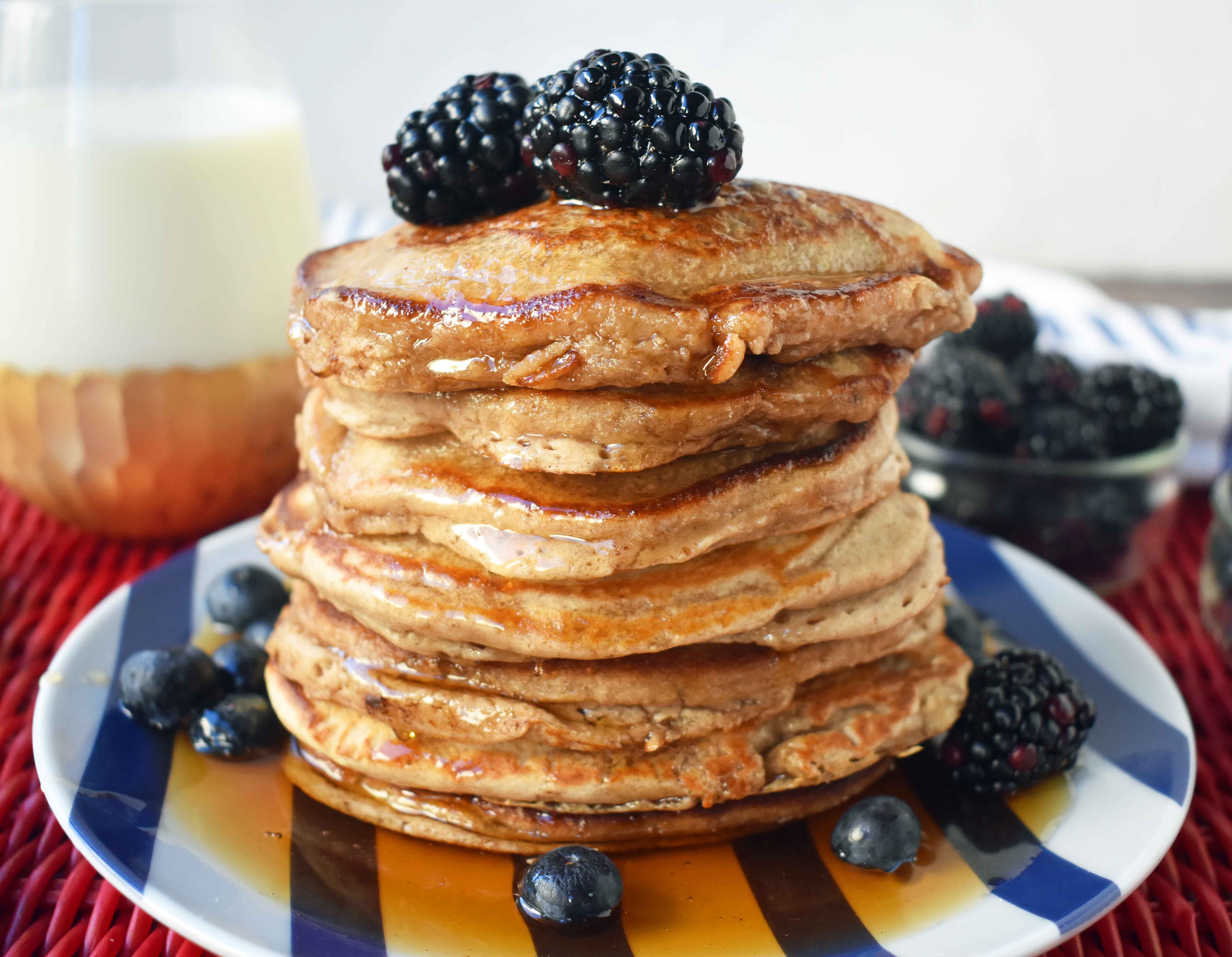Healthy Banana Oatmeal Pancakes by Modern Honey. No sugar, No oil, Gluten-free, Dairy-free pancakes. Made with only 7 ingredients - oats, almond milk, banana, eggs, egg whites, baking powder, salt, and a touch of real maple syrup.