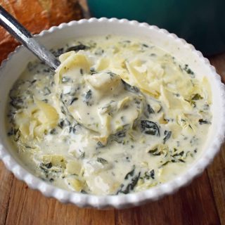 Creamy Spinach Artichoke Soup by Modern Honey. Rich and creamy parmesan cheese cream soup with spinach and artichokes. Perfect soup for a cold winter's day. www.modernhoney.com