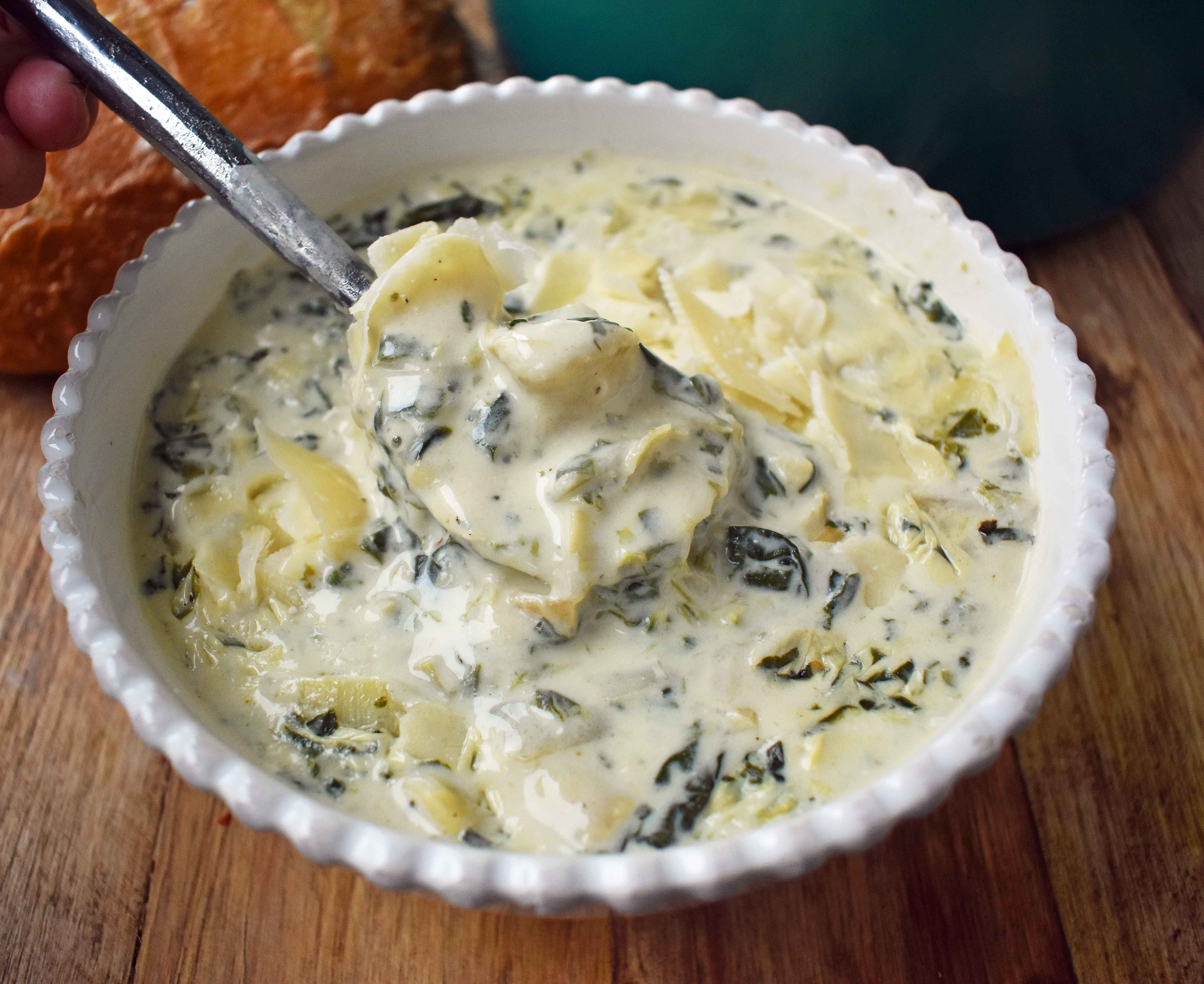 Creamy Spinach Artichoke Soup by Modern Honey. Rich and creamy parmesan cheese cream soup with spinach and artichokes. Perfect soup for a cold winter's day. www.modernhoney.com