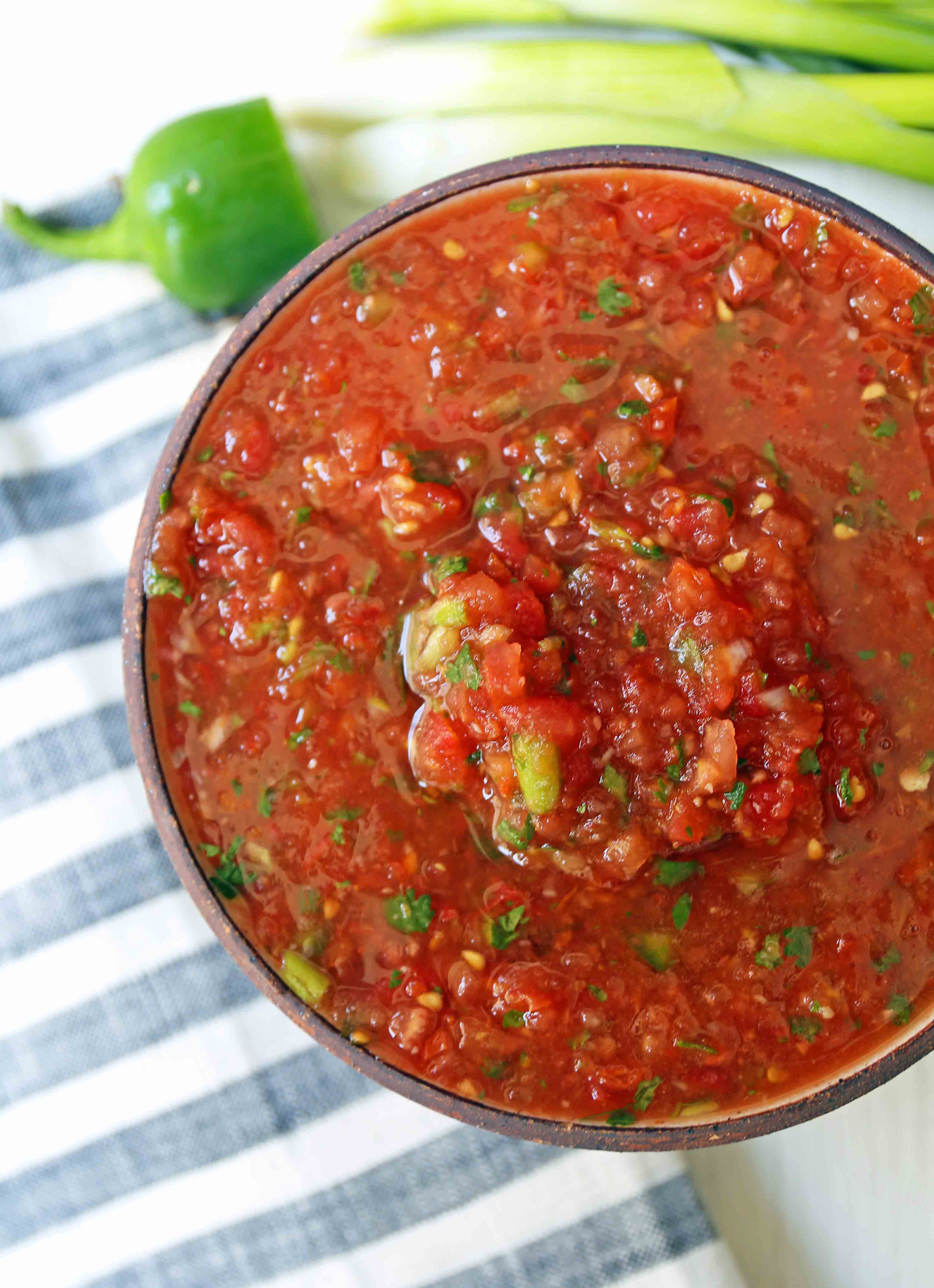 Homemade Restaurant Style Salsa. Fresh salsa made with fresh tomatoes, cilantro, green onion, jalapeno, and a secret ingredient! www.modernhoney.com