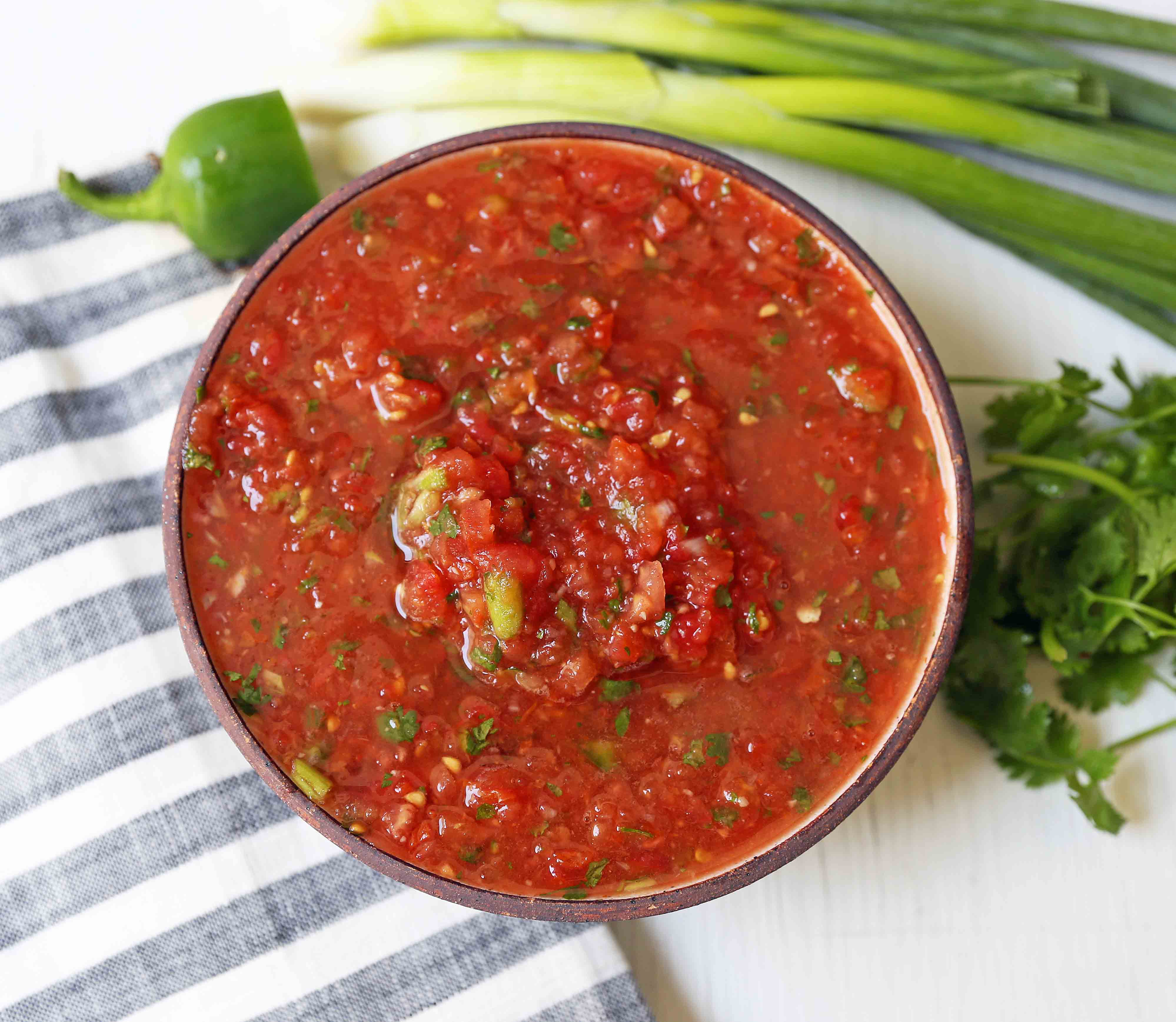 Homemade Restaurant Style Salsa. Fresh salsa made with fresh tomatoes, cilantro, green onion, jalapeno, and a secret ingredient! www.modernhoney.com