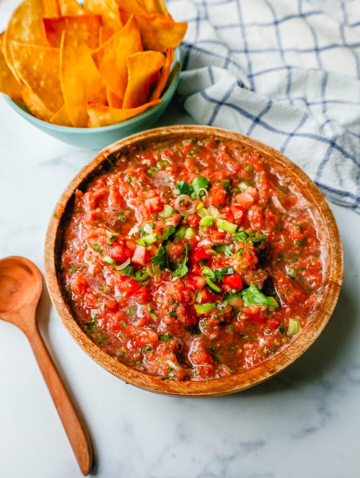 This is the best homemade salsa recipe! Fresh salsa made with the freshest of ingredients -- tomatoes, cilantro, jalapeno, green onions, and a secret ingredient makes this homemade salsa taste like it's from an authentic Mexican restaurant!