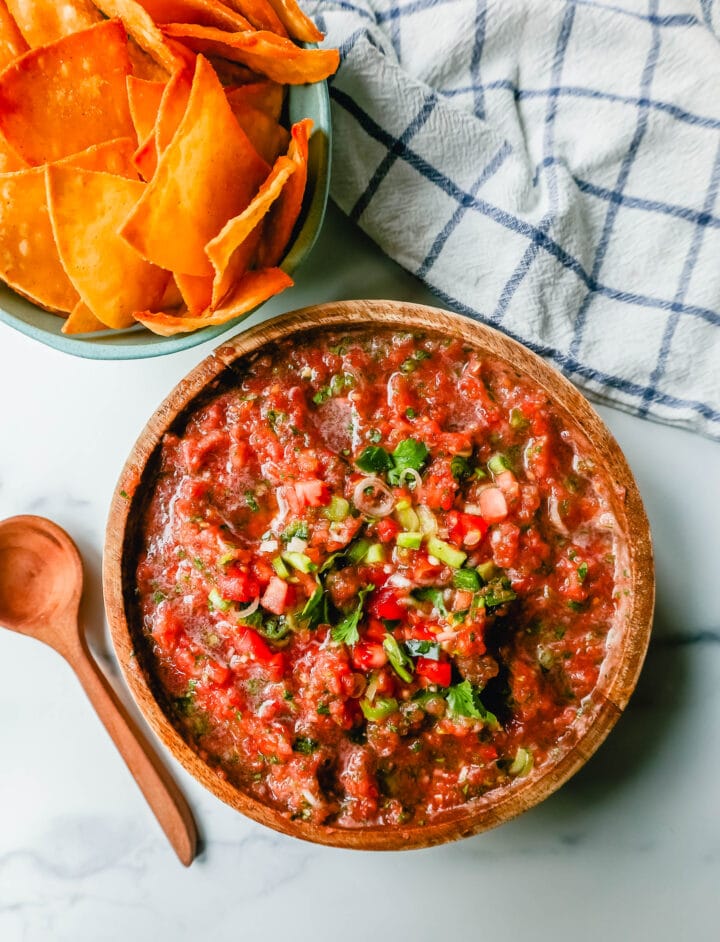 This is the best homemade salsa recipe! Fresh salsa made with the freshest of ingredients -- tomatoes, cilantro, jalapeno, green onions, and a secret ingredient makes this homemade salsa taste like it's from an authentic Mexican restaurant!