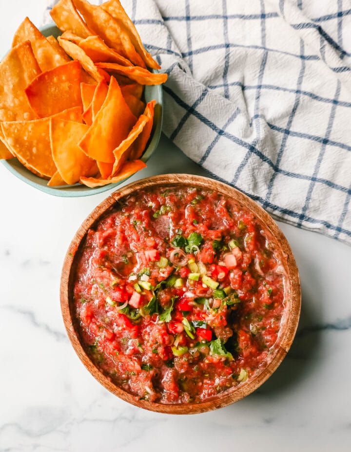 This is the best homemade salsa recipe! Fresh salsa made with the freshest of ingredients -- tomatoes, cilantro, jalapeno, green onions, and a secret ingredient makes this homemade salsa taste like it's from an authentic Mexican restaurant!