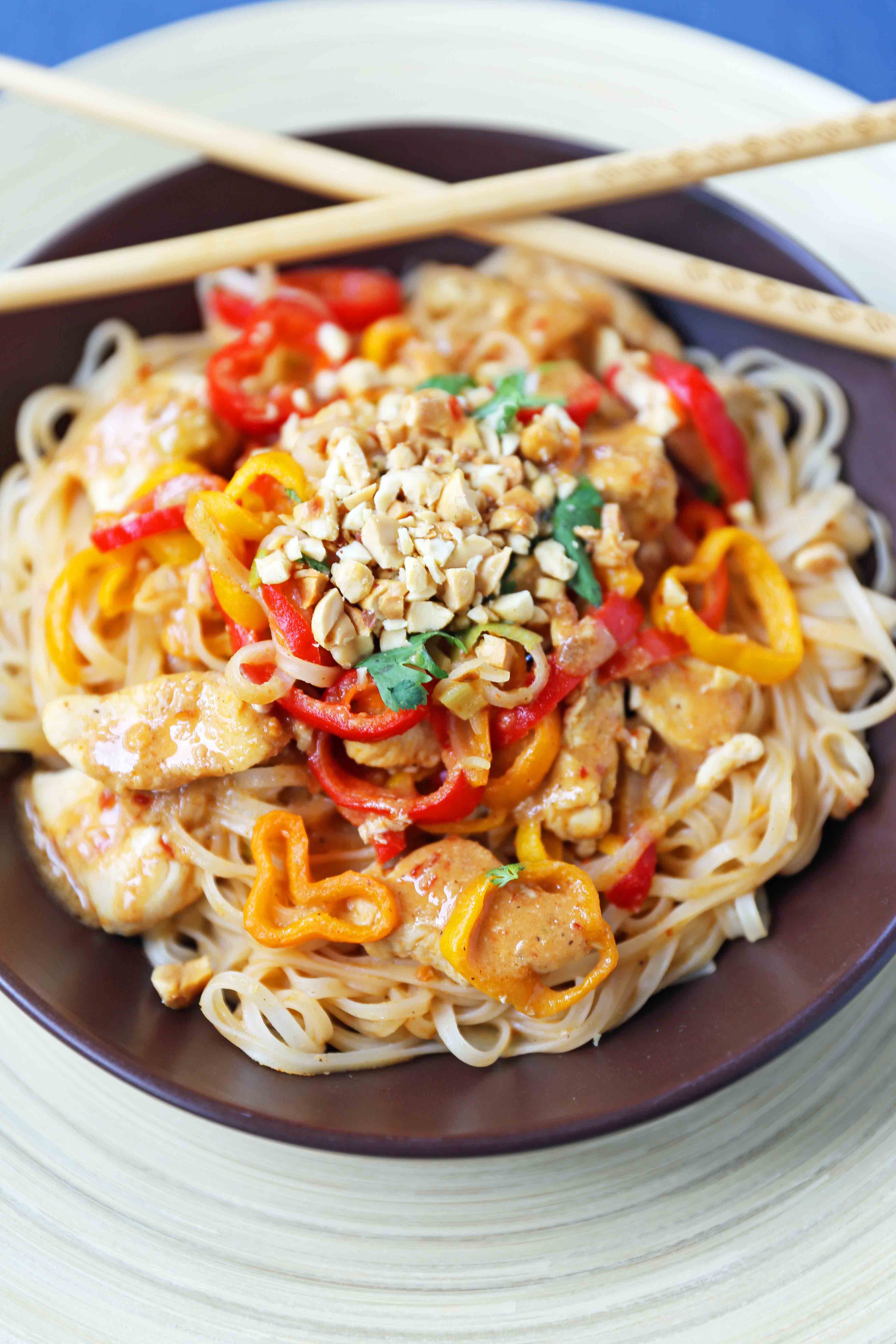 Thai Chicken Noodles. Healthy thai chicken, fresh vegetables, sauteed with a light peanut butter sauce. Better than take-out thai chicken noodles. www.modernhoney.com #thaichickennoodles