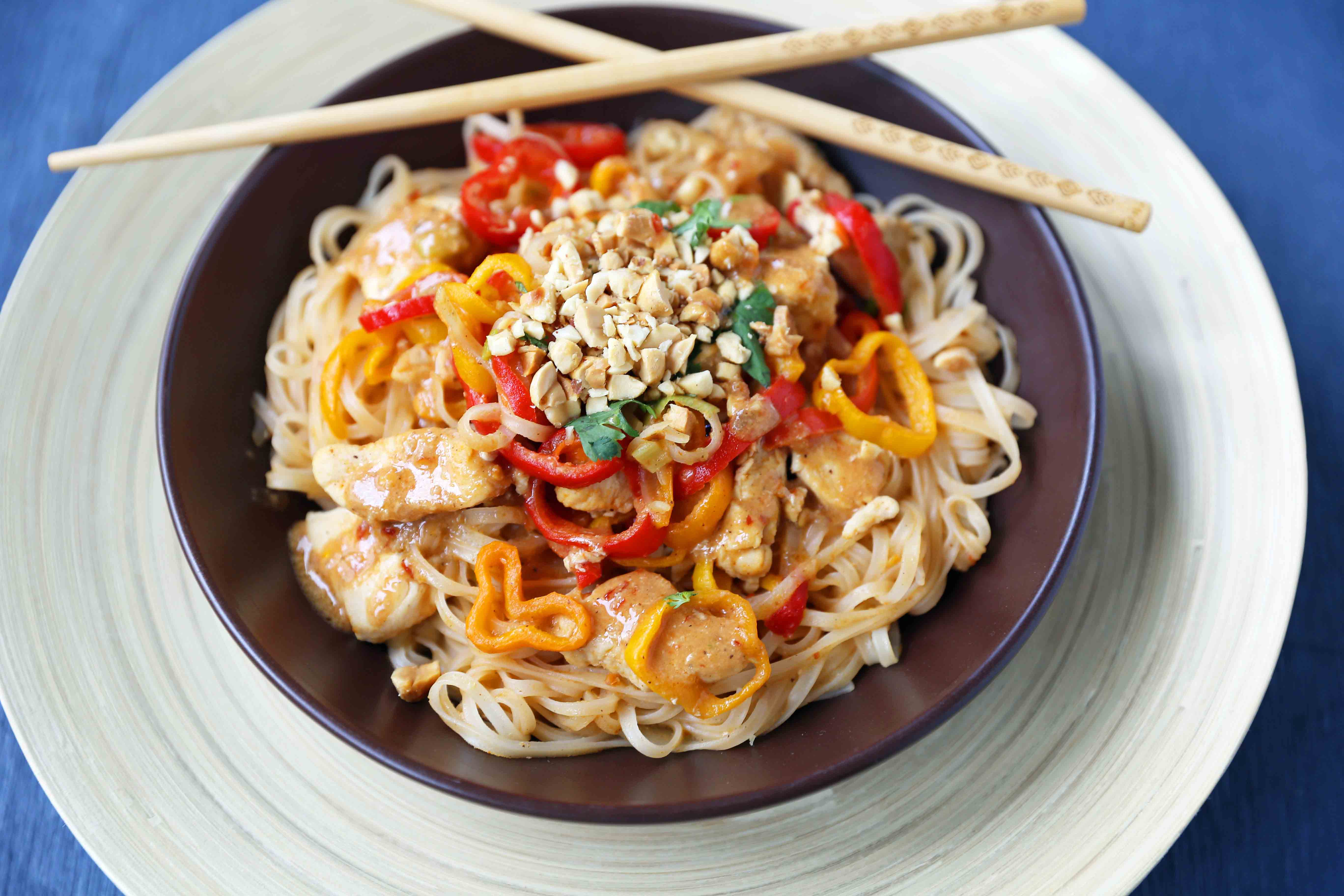 Thai Chicken Noodles. Healthy thai chicken, fresh vegetables, sauteed with a light peanut butter sauce. Better than take-out thai chicken noodles. www.modernhoney.com #thaichickennoodles