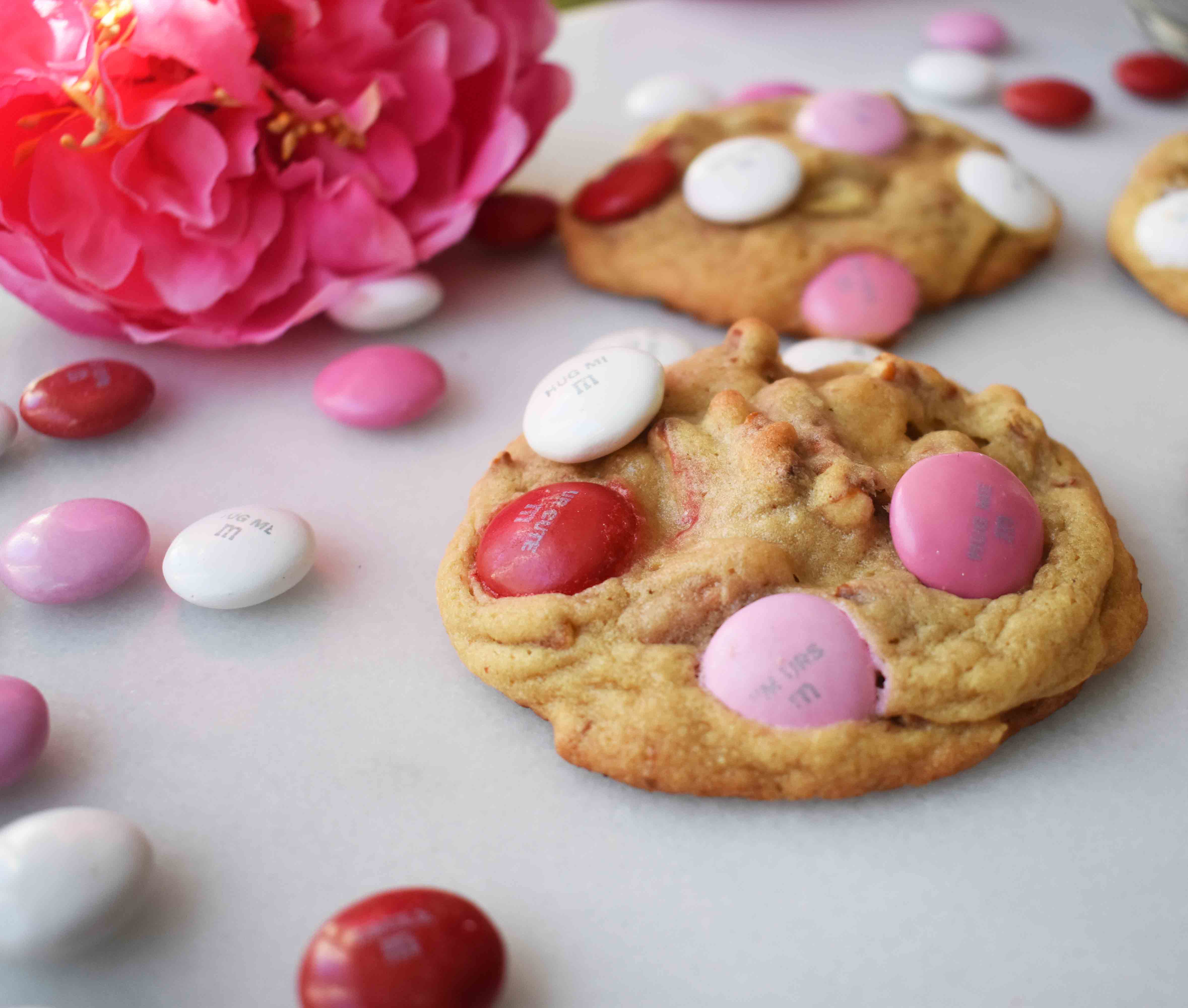 Heartbreaker M & M Pretzel Cookies made with sweet dough, crunchy salty pretzels, and chocolate M & M's. The perfect salty and sweet cookie. www.modernhoney.com