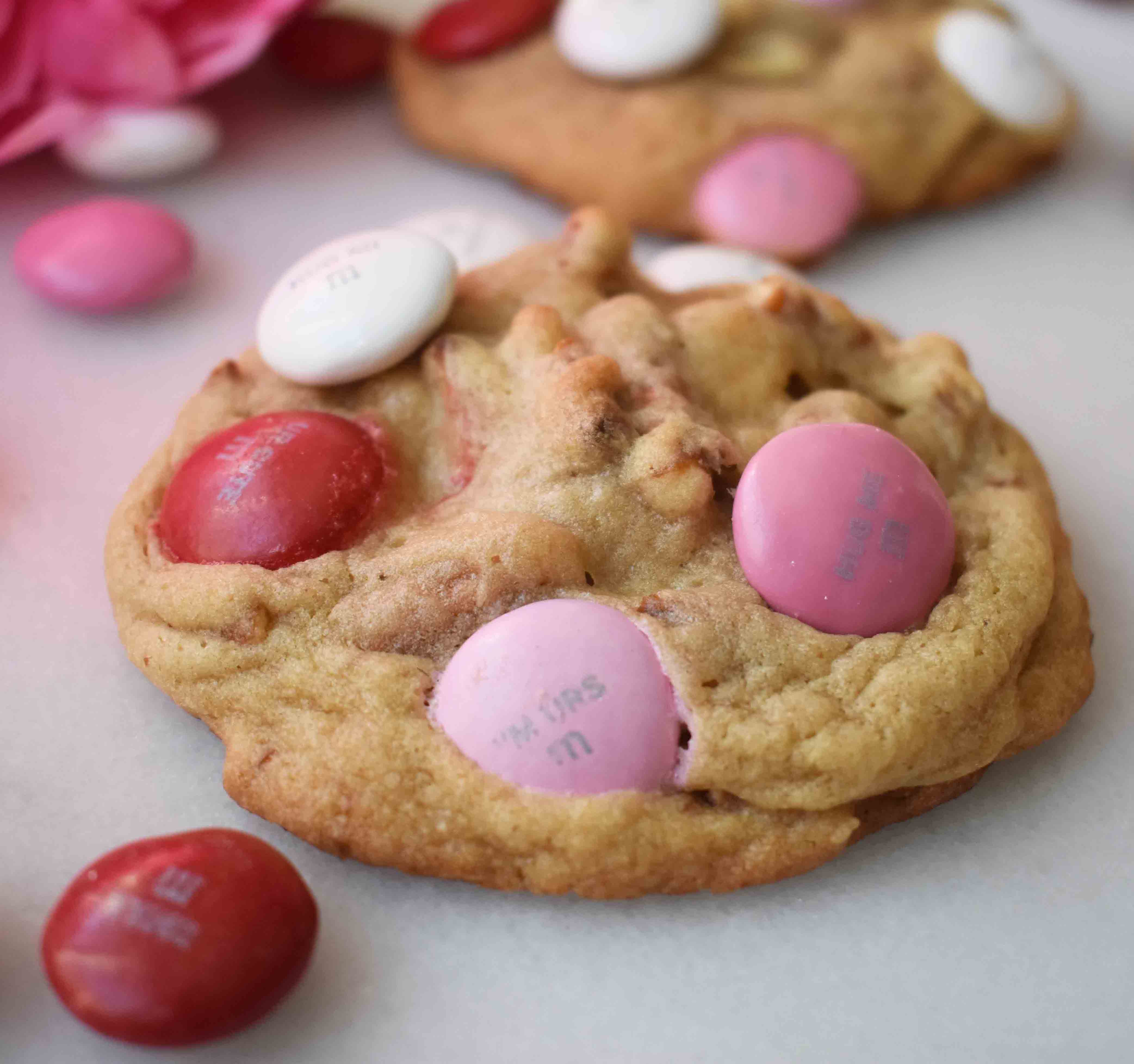 Heartbreaker M & M Pretzel Cookies made with sweet dough, crunchy salty pretzels, and chocolate M & M's. The perfect salty and sweet cookie. www.modernhoney.com