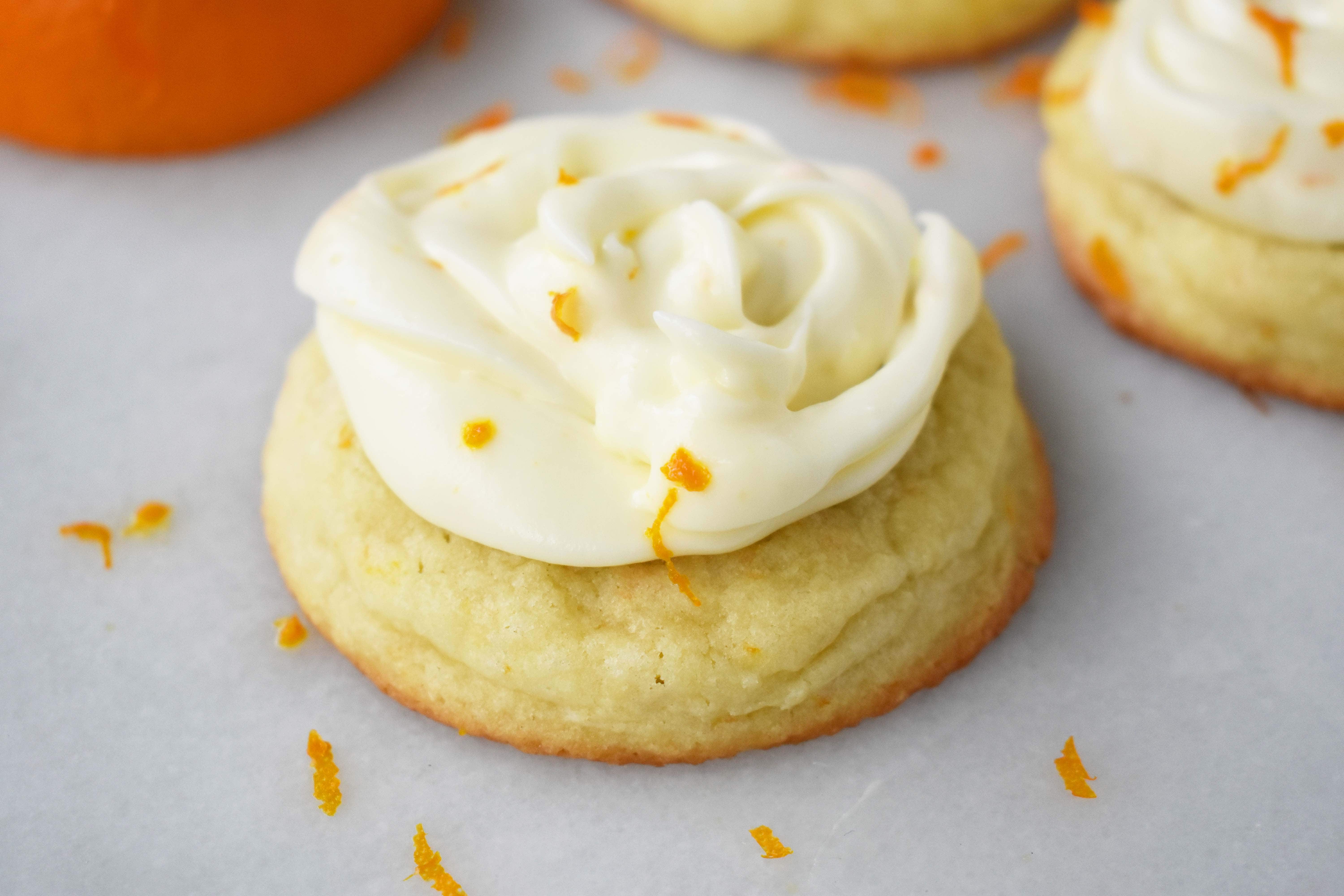 RubySnap Judy Orange Cream Cookies. Soft citrus orange dough cookie topped with sweet orange cream cheese frosting. An orange cream lovers dream cookie! www.modernhoney.com