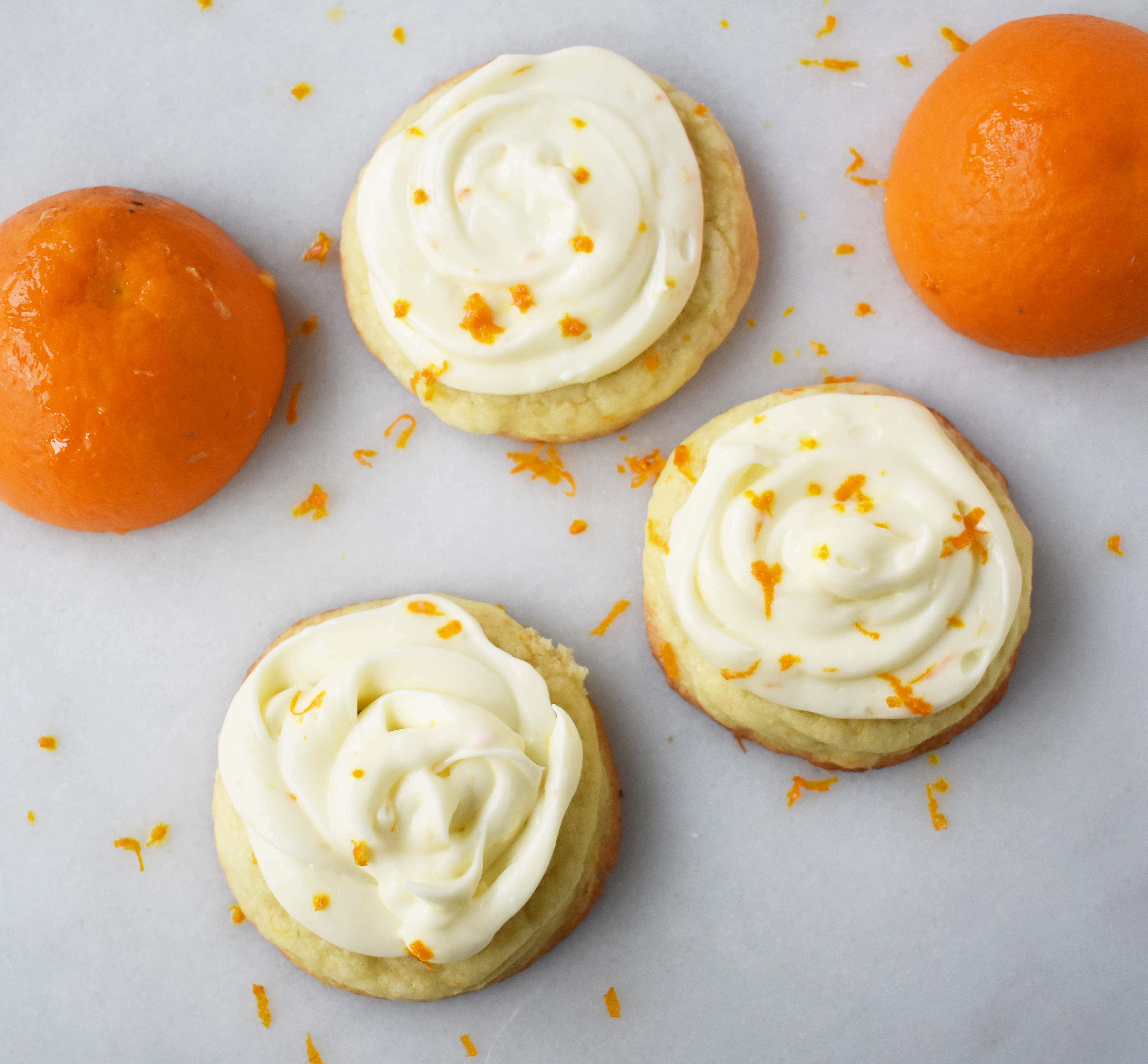 RubySnap Judy Orange Cream Cookies. Soft citrus orange dough cookie topped with sweet orange cream cheese frosting. An orange cream lovers dream cookie! www.modernhoney.com