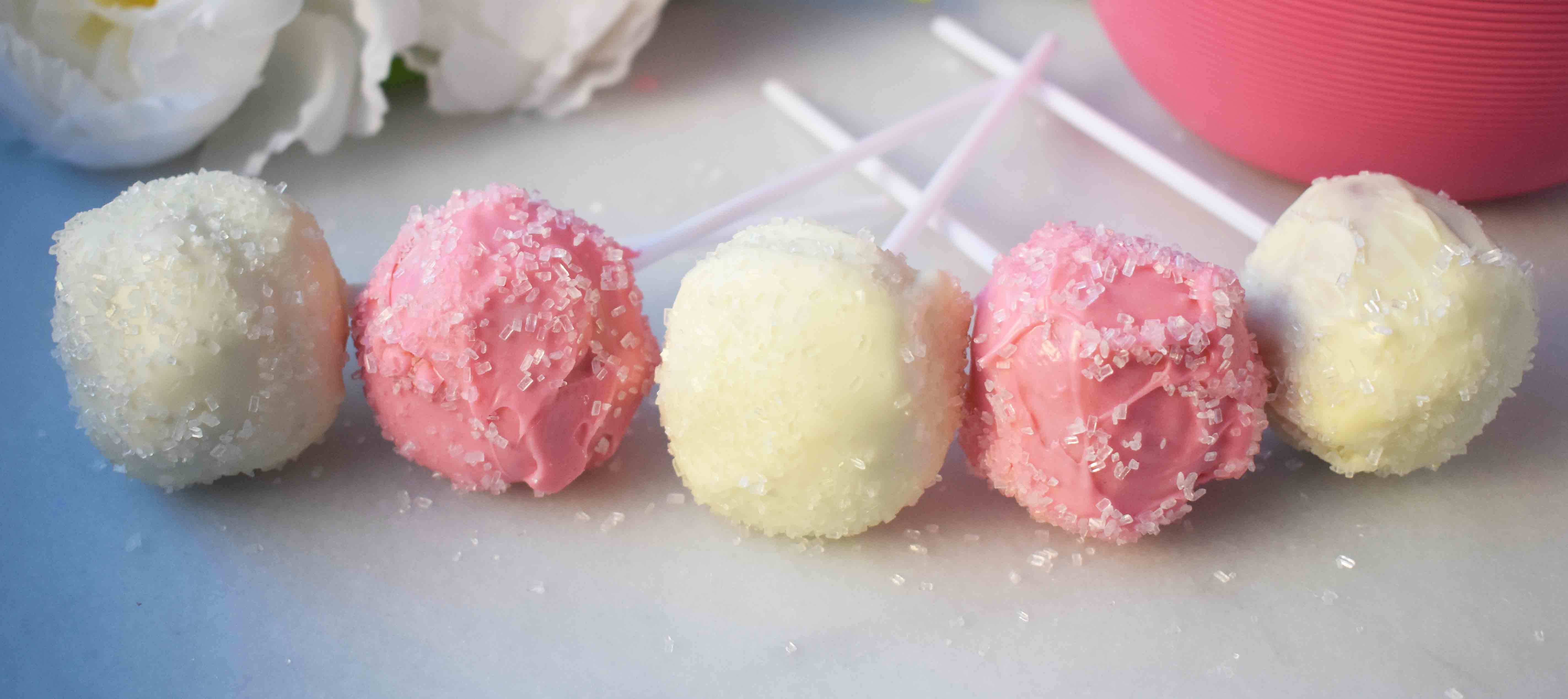 Strawberry Cheesecake Truffle Balls Cake Pops. Homemade yellow butter cake mixed with fresh strawberry cream cheese frosting. Then rolled in melted white melting wafers and sprinkled with sparkling sugar. www.modernhoney.com