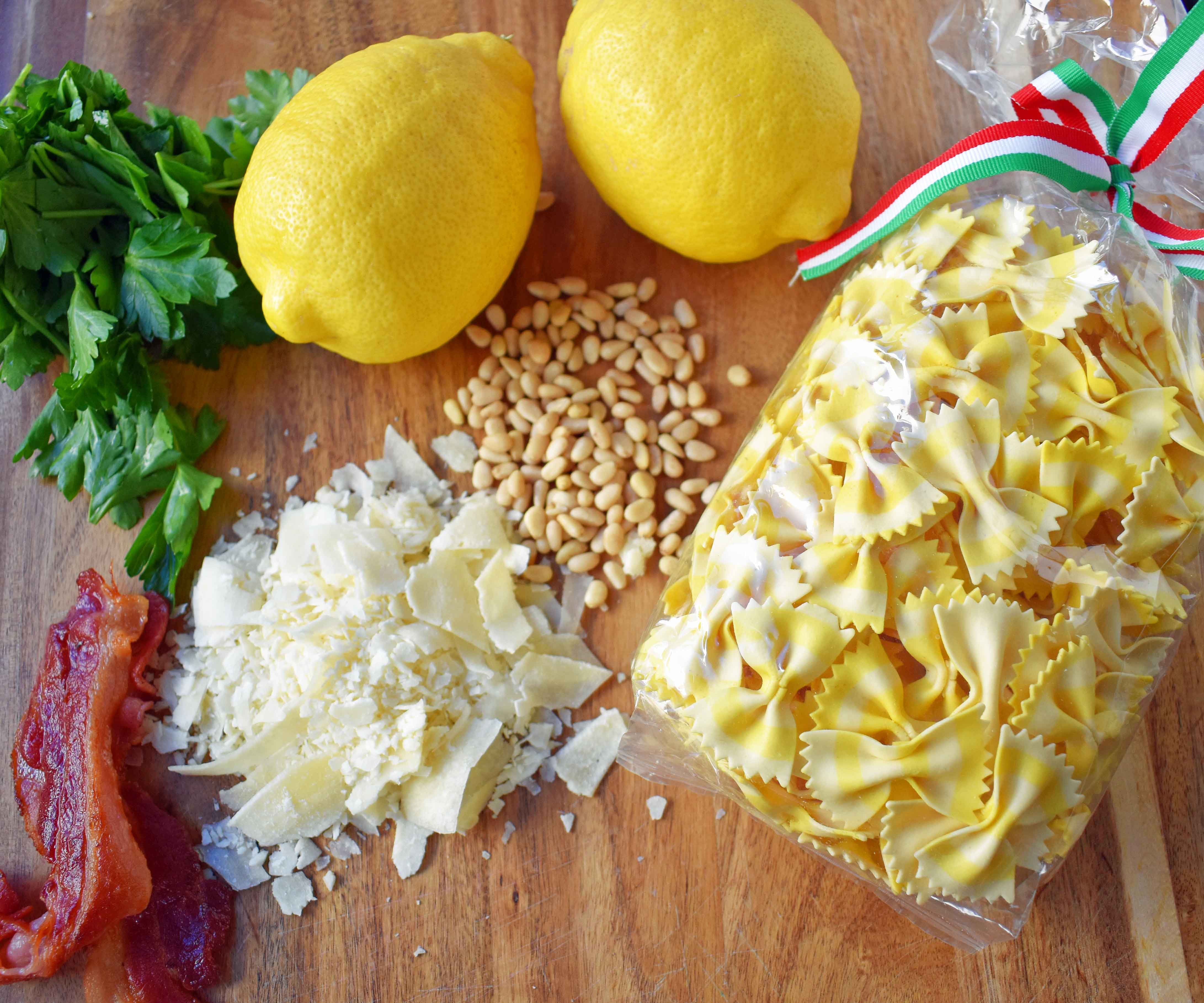 Lemon Garlic and Crispy Bacon Pasta. Farfalle, bowtie pasta, with butter, caramelized onions, and garlic all topped with crispy bacon, parmesan cheese, and pine nuts. A light and fresh pasta with lemon butter and bacon. www.modernhoney.com