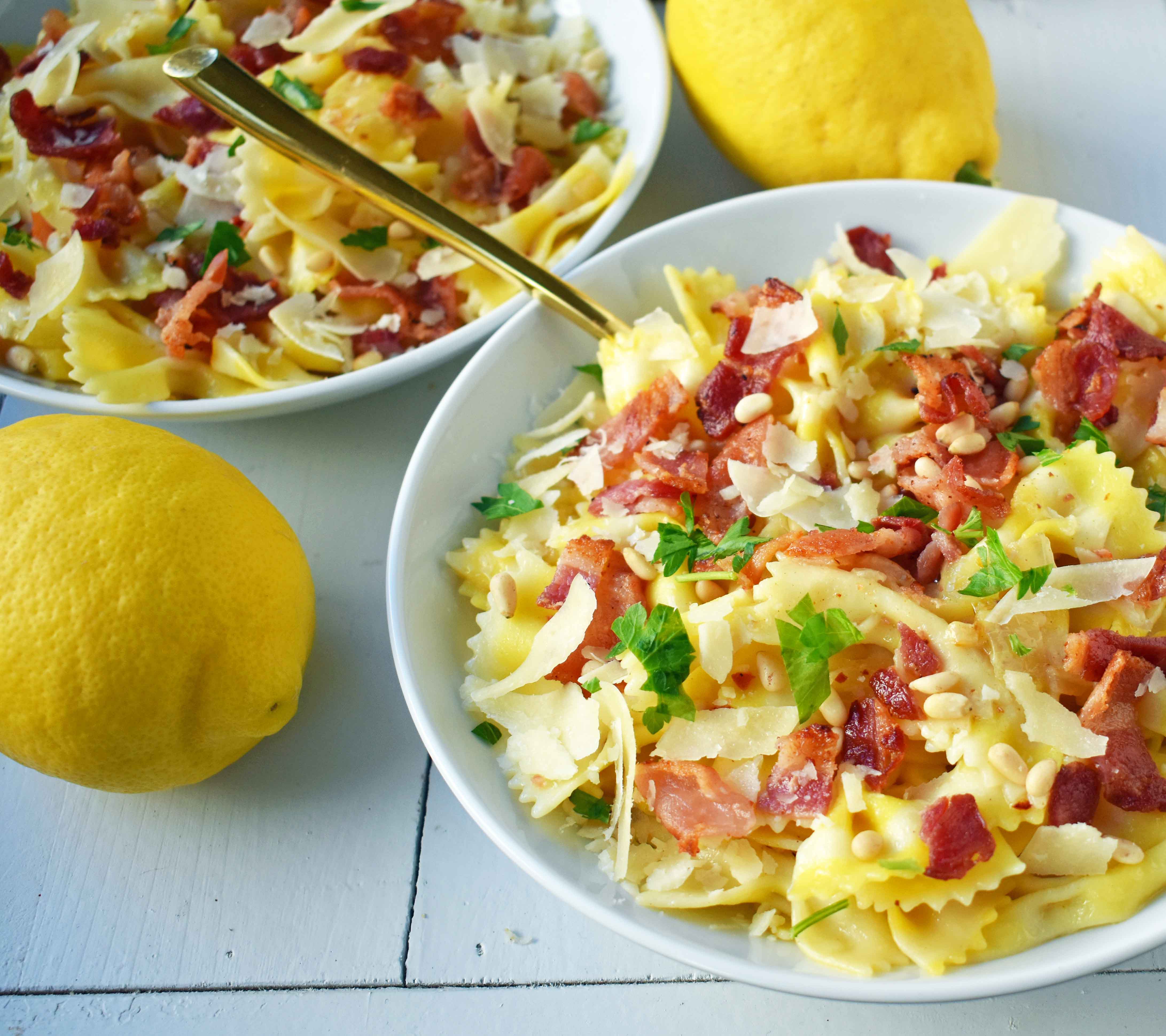 Lemon Garlic and Crispy Bacon Pasta. Farfalle, bowtie pasta, with butter, caramelized onions, and garlic all topped with crispy bacon, parmesan cheese, and pine nuts. A light and fresh pasta with lemon butter and bacon. www.modernhoney.com
