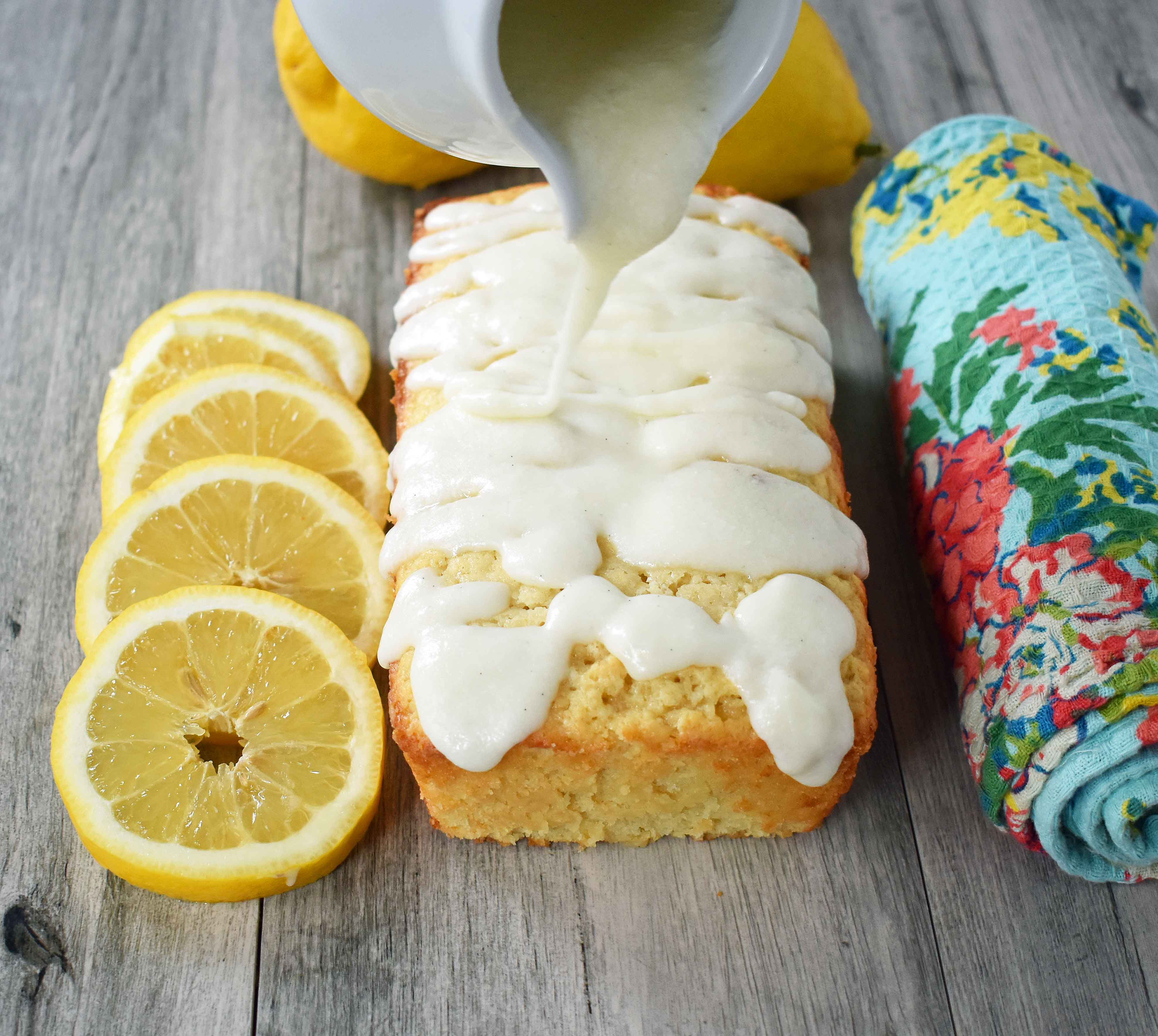 Greek Yogurt Lemon Bread with Vanilla Bean Glaze and Coconut. Sweet and moist lemon yogurt cake topped with creamy vanilla glaze. www.modernhoney.com