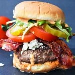 Dragonslayer Burger. Beef with blue cheese, crispy bacon, juicy tomatoes, crunchy pickles, spring mix, and buffalo ranch sauce. www.modernhoney.com