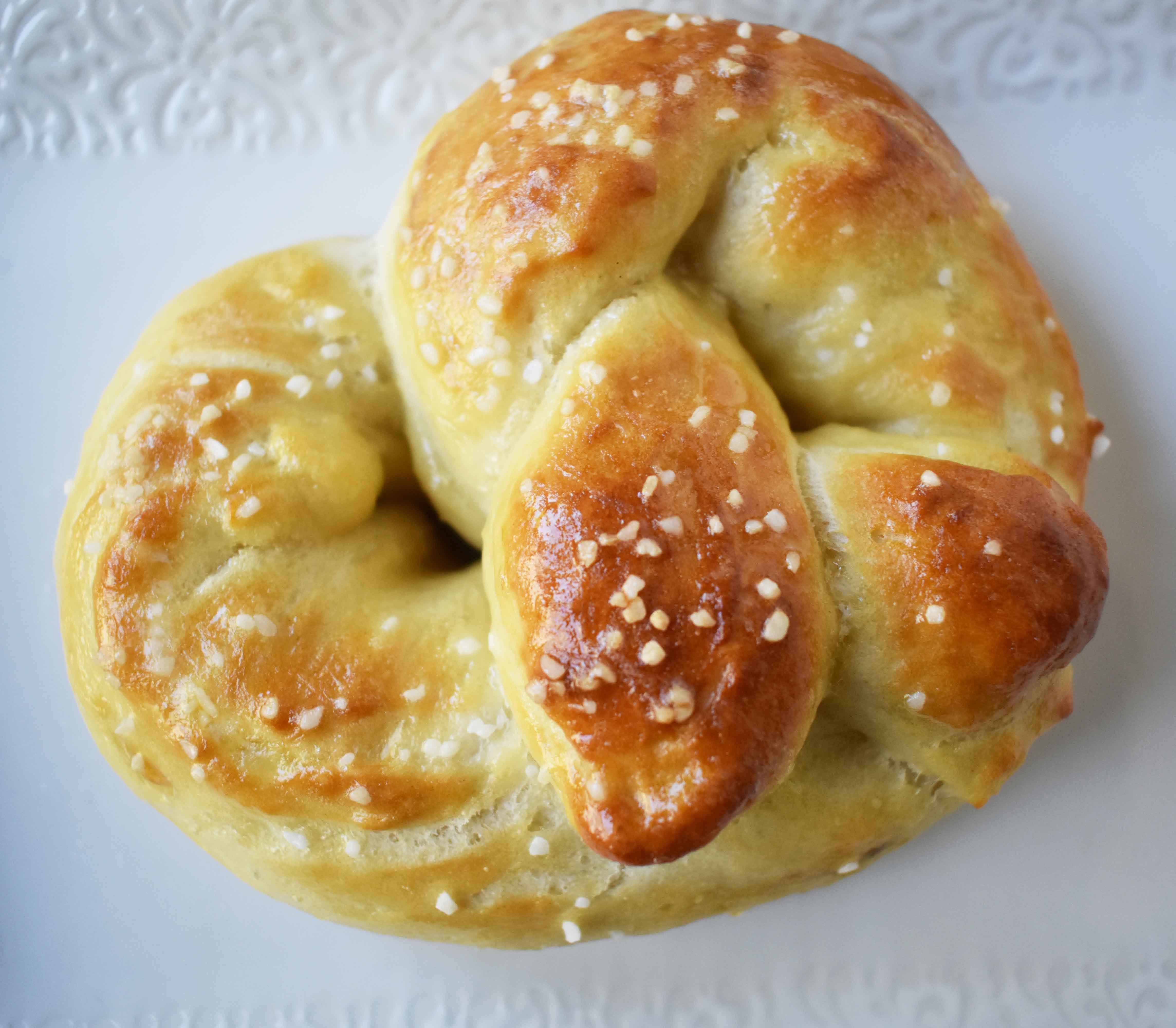 Buttery Soft Pretzels. Homemade, made from scratch soft pretzels. Buttery, soft, and fluffy pretzels with melted butter and coarse salt. Super easy to make! www.modernhoney.com