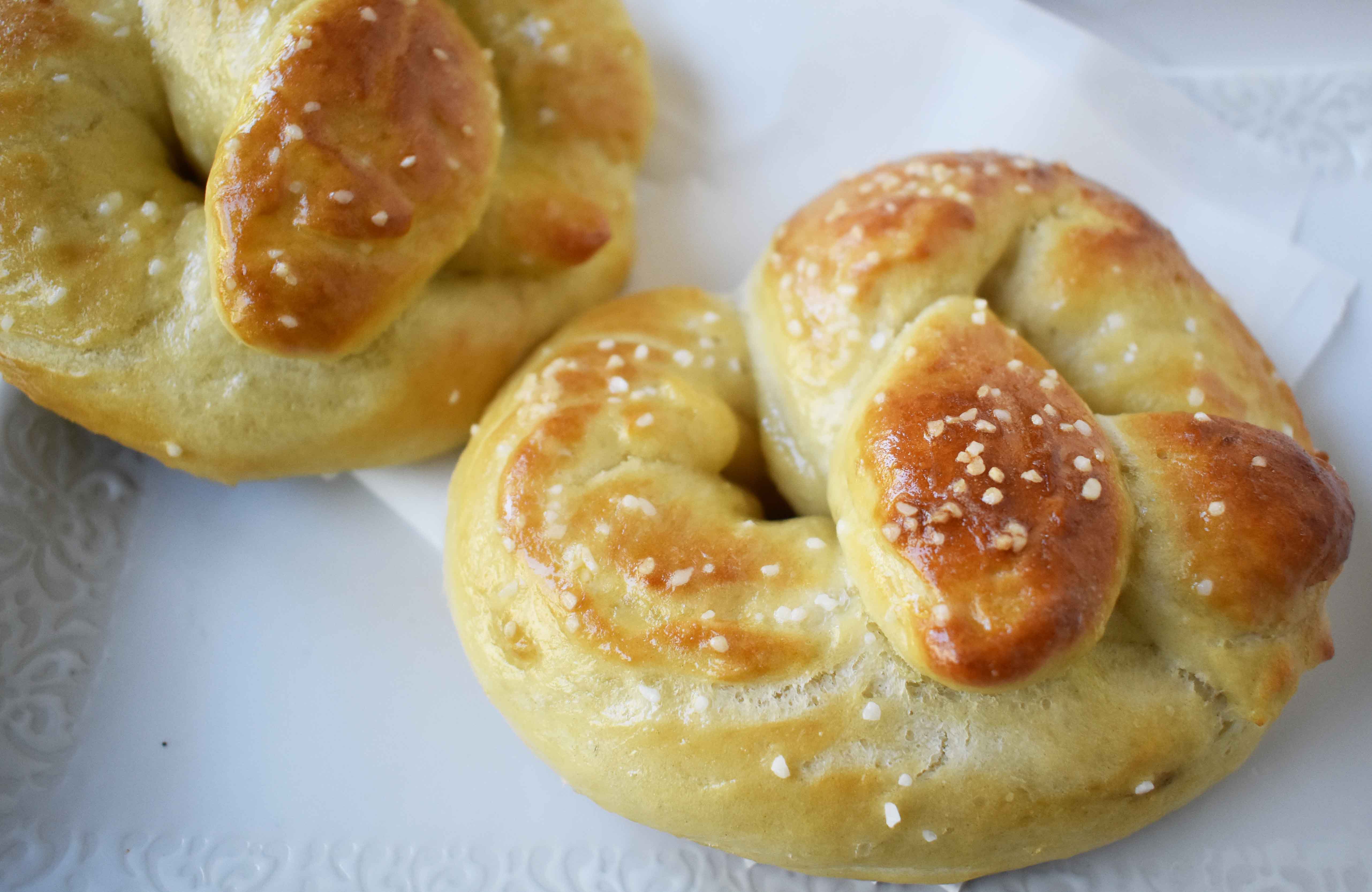 Buttery Soft Pretzels. Homemade, made from scratch soft pretzels. Buttery, soft, and fluffy pretzels with melted butter and coarse salt. Super easy to make! www.modernhoney.com