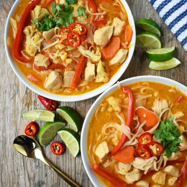 Thai Chicken Noodle Soup. Gluten-free and Dairy-Free nutritious soup that is full of flavor. A rich coconut milk red curry based broth filled with onions, carrots, ginger, cauliflower, and red pepper. A healthy and delicious soup that everyone loves! www.modernhoney.com