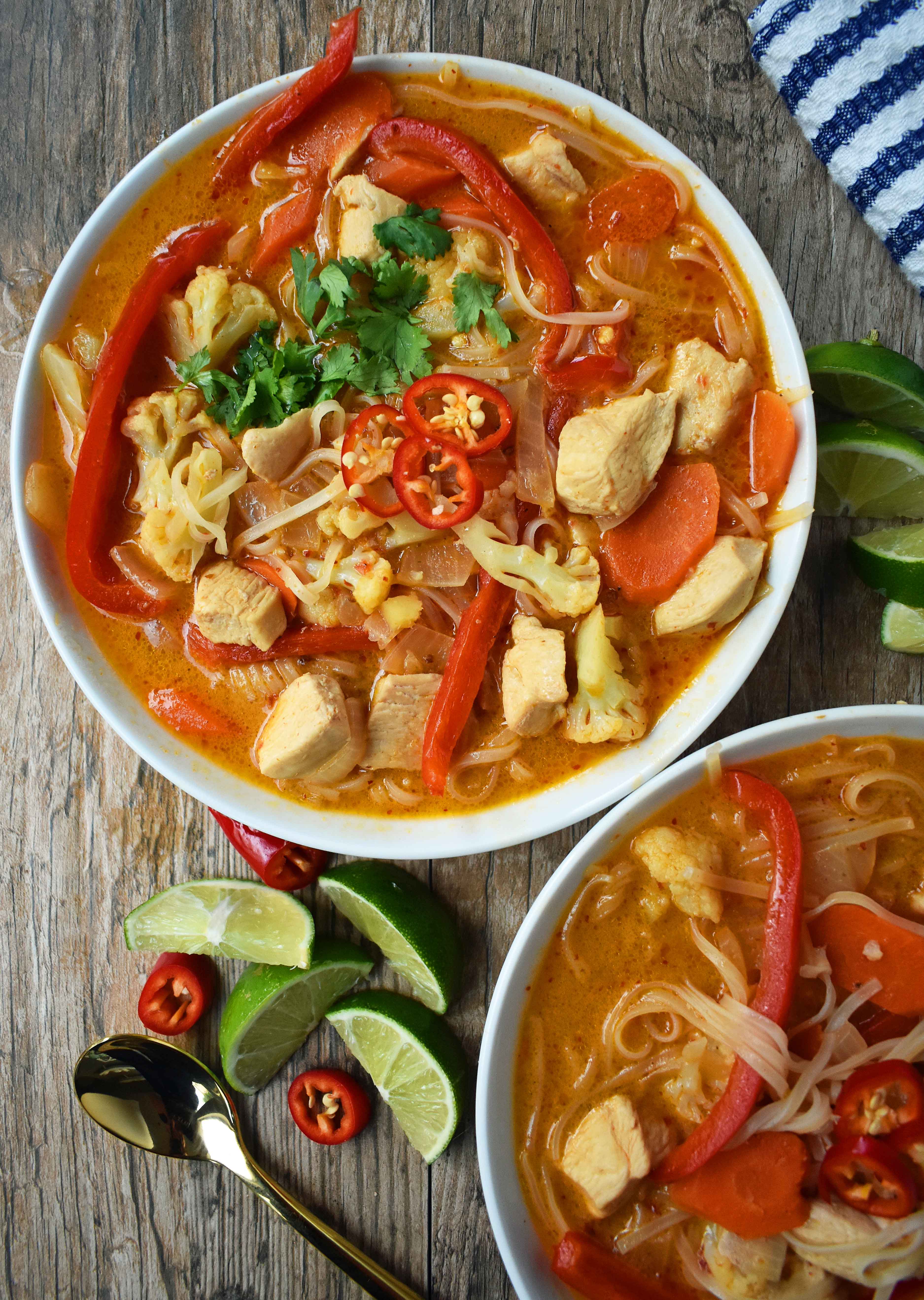 Thai Chicken Noodle Soup. Gluten-free and Dairy-Free nutritious soup that is full of flavor. A rich coconut milk red curry based broth filled with onions, carrots, ginger, cauliflower, and red pepper. A healthy and delicious soup that everyone loves! www.modernhoney.com