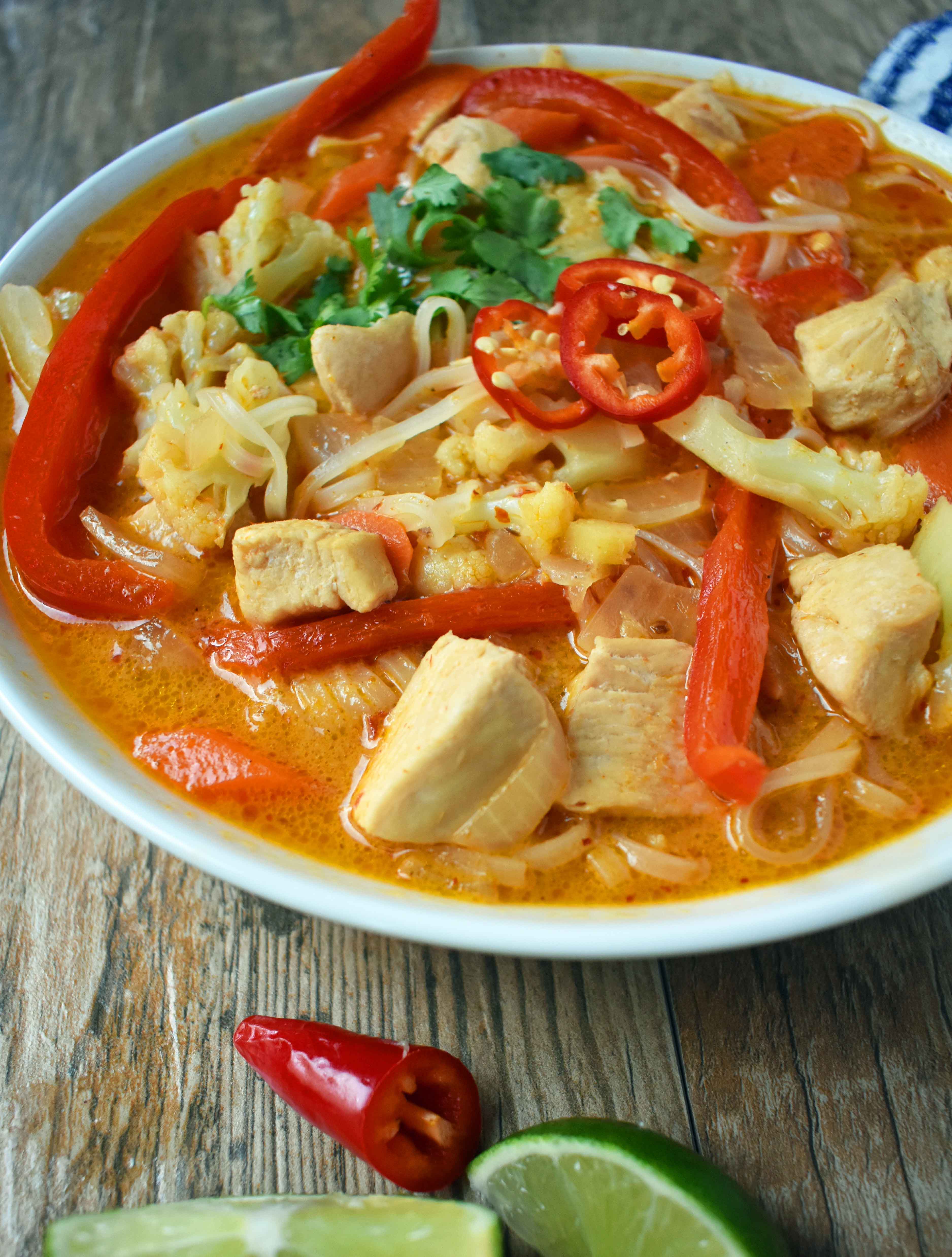 Thai Chicken Noodle Soup. Gluten-free and Dairy-Free nutritious soup that is full of flavor. A rich coconut milk red curry based broth filled with onions, carrots, ginger, cauliflower, and red pepper. A healthy and delicious soup that everyone loves! www.modernhoney.com
