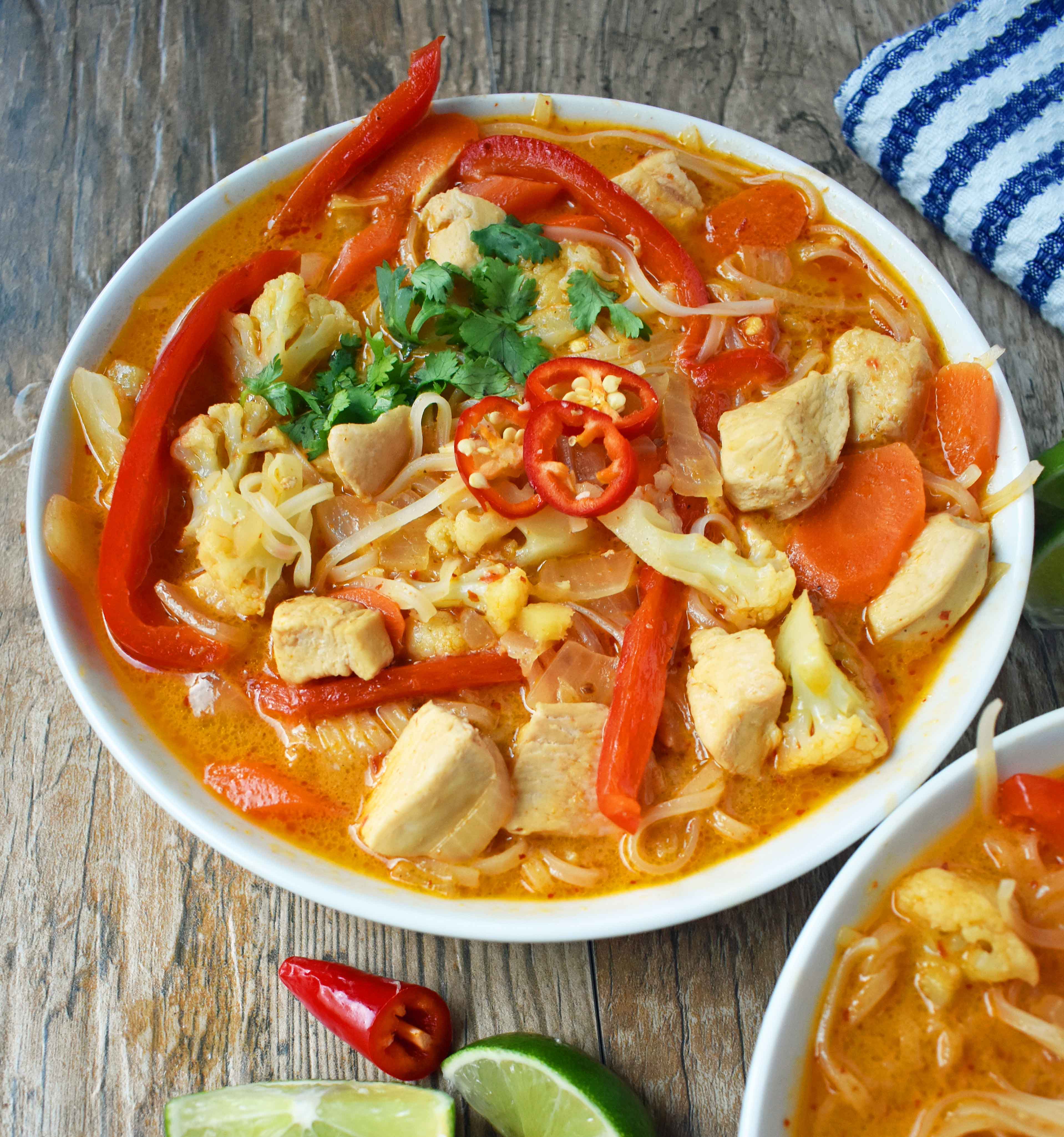 Thai Chicken Noodle Soup. Gluten-free and Dairy-Free nutritious soup that is full of flavor. A rich coconut milk red curry based broth filled with onions, carrots, ginger, cauliflower, and red pepper. A healthy and delicious soup that everyone loves! www.modernhoney.com