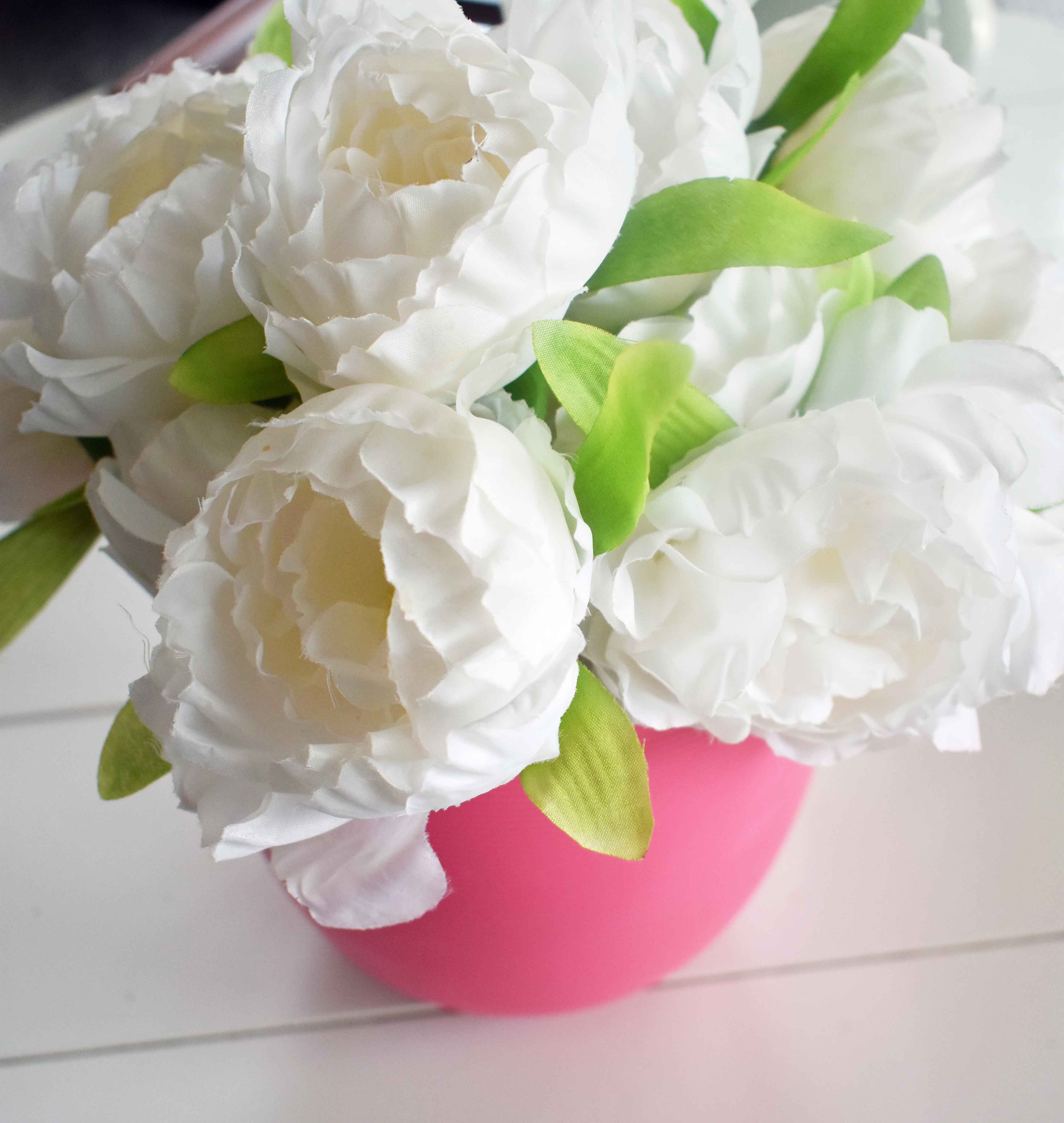 Spring Decoration Ideas. Bright and beautiful white peonies in a pink pot to beautify your home. www.modernhoney.com