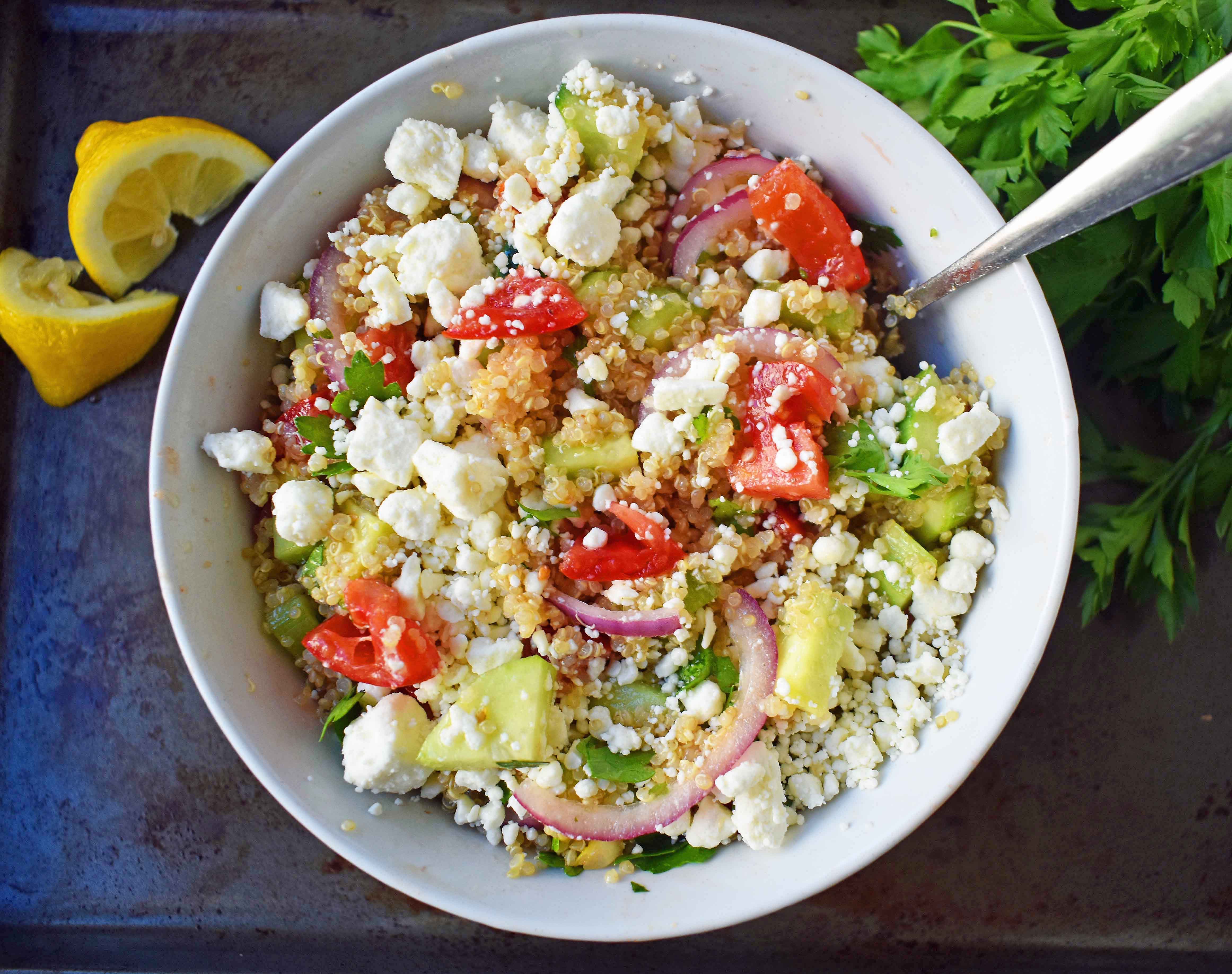 Mediterranean Quinoa Salad. Quinoa tossed with fresh tomatoes, cucumber, red onion, italian parsley, extra virgin olive oil, red wine vinegar, and feta cheese. A healthy, beautiful salad! www.modernhoney.com